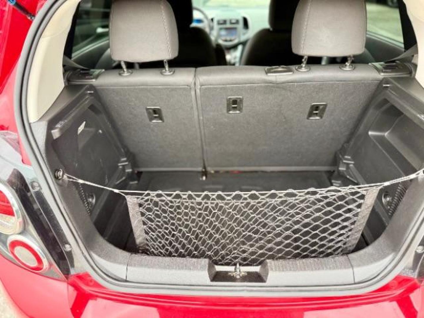 2016 RED Chevrolet Sonic LT Auto 5-Door (1G1JC6SH9G4) with an 1.8L L4 DOHC 24V engine, 6-Speed Automatic transmission, located at 4545 Spencer Hwy., Pasadena, 77504, (832) 266-1645, 29.666037, -95.173775 - Photo#9