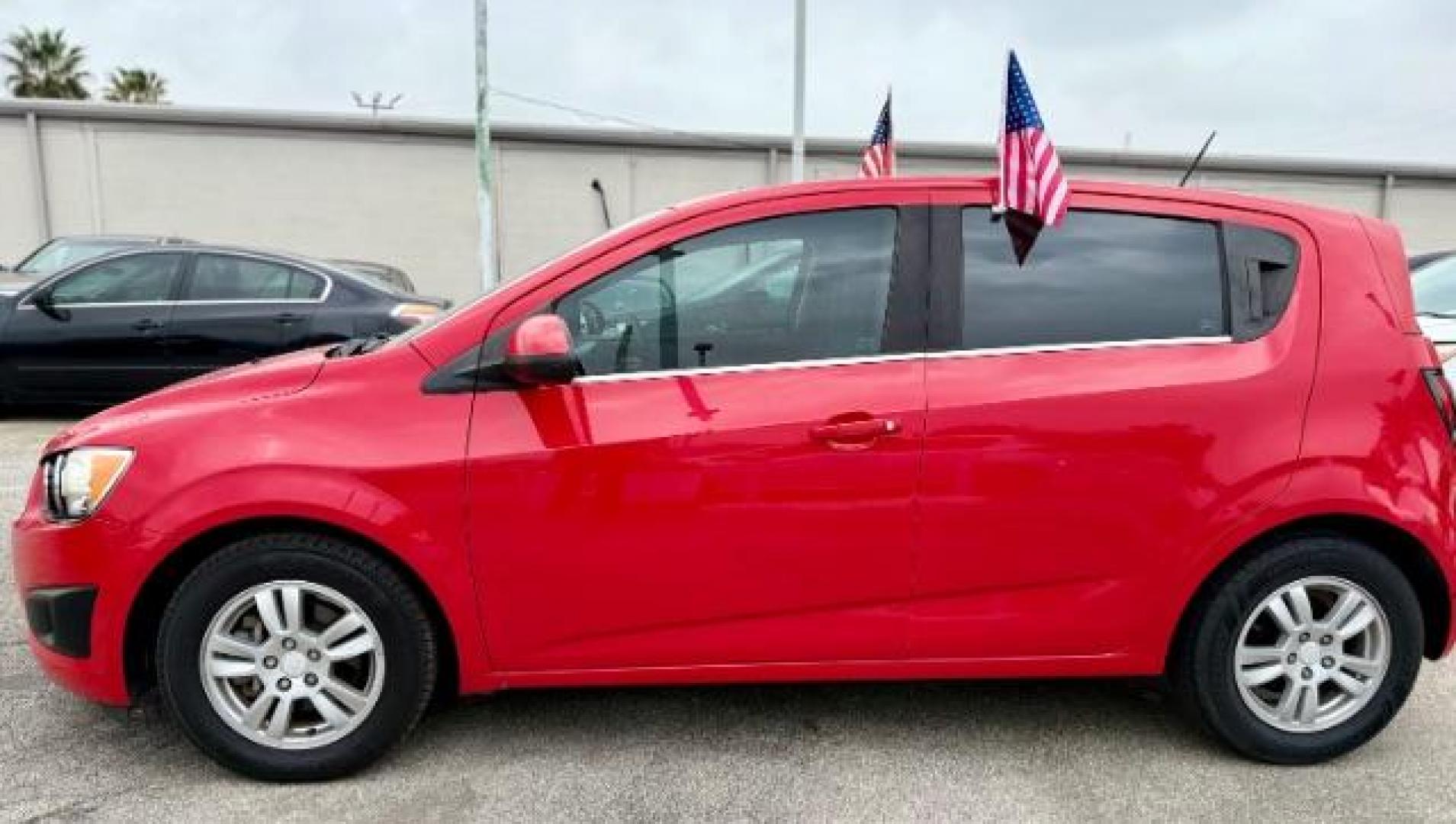 2016 RED Chevrolet Sonic LT Auto 5-Door (1G1JC6SH9G4) with an 1.8L L4 DOHC 24V engine, 6-Speed Automatic transmission, located at 4545 Spencer Hwy., Pasadena, 77504, (832) 266-1645, 29.666037, -95.173775 - Photo#1