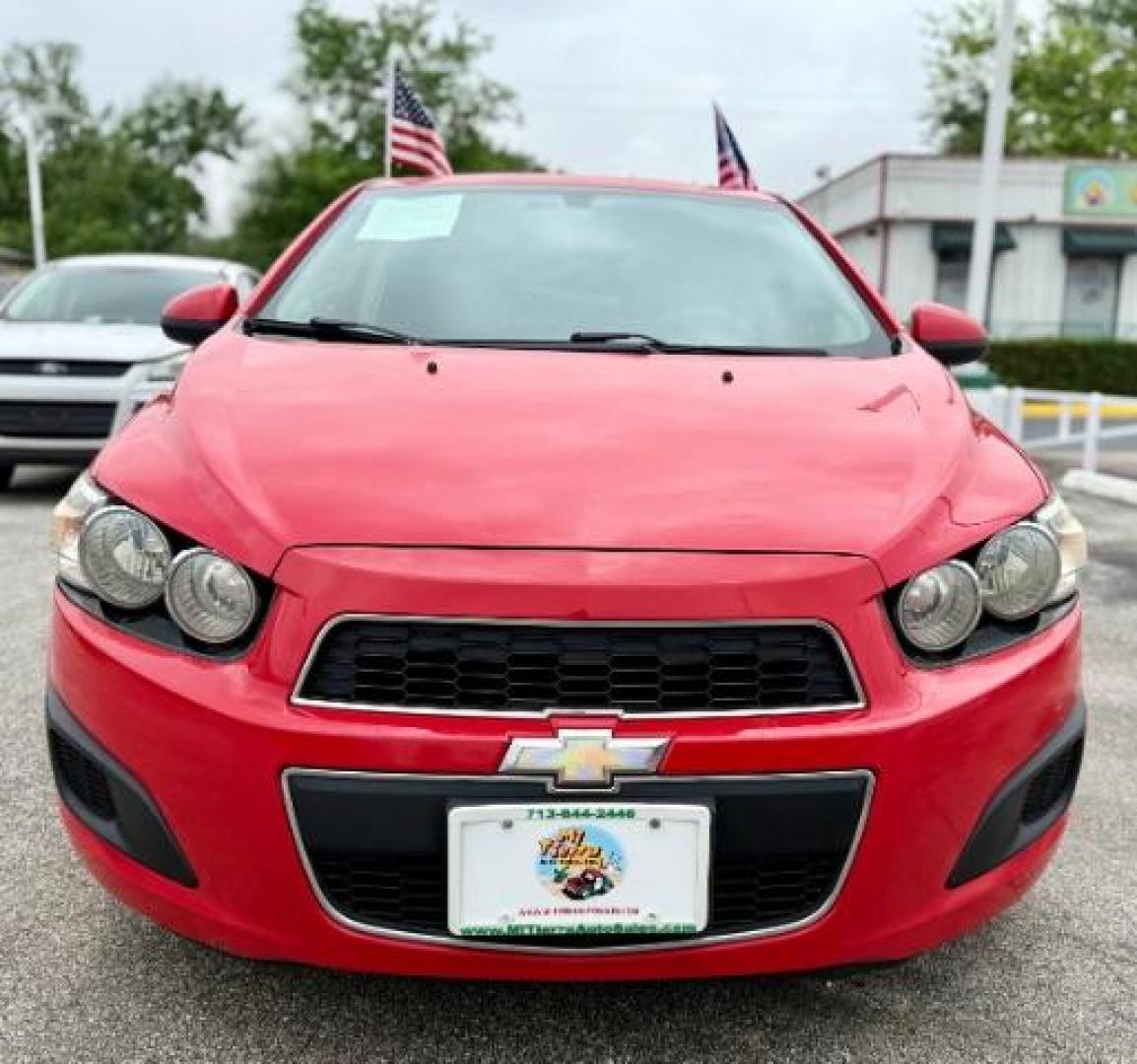 2016 RED Chevrolet Sonic LT Auto 5-Door (1G1JC6SH9G4) with an 1.8L L4 DOHC 24V engine, 6-Speed Automatic transmission, located at 4545 Spencer Hwy., Pasadena, 77504, (832) 266-1645, 29.666037, -95.173775 - Photo#2