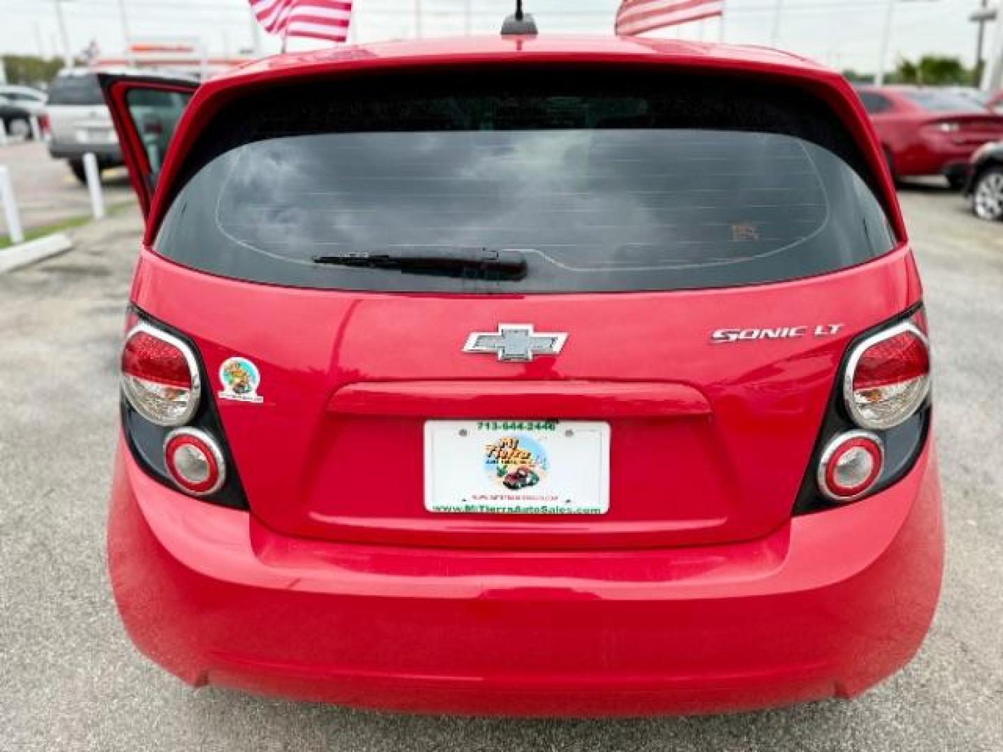 2016 RED Chevrolet Sonic LT Auto 5-Door (1G1JC6SH9G4) with an 1.8L L4 DOHC 24V engine, 6-Speed Automatic transmission, located at 4545 Spencer Hwy., Pasadena, 77504, (832) 266-1645, 29.666037, -95.173775 - Photo#4