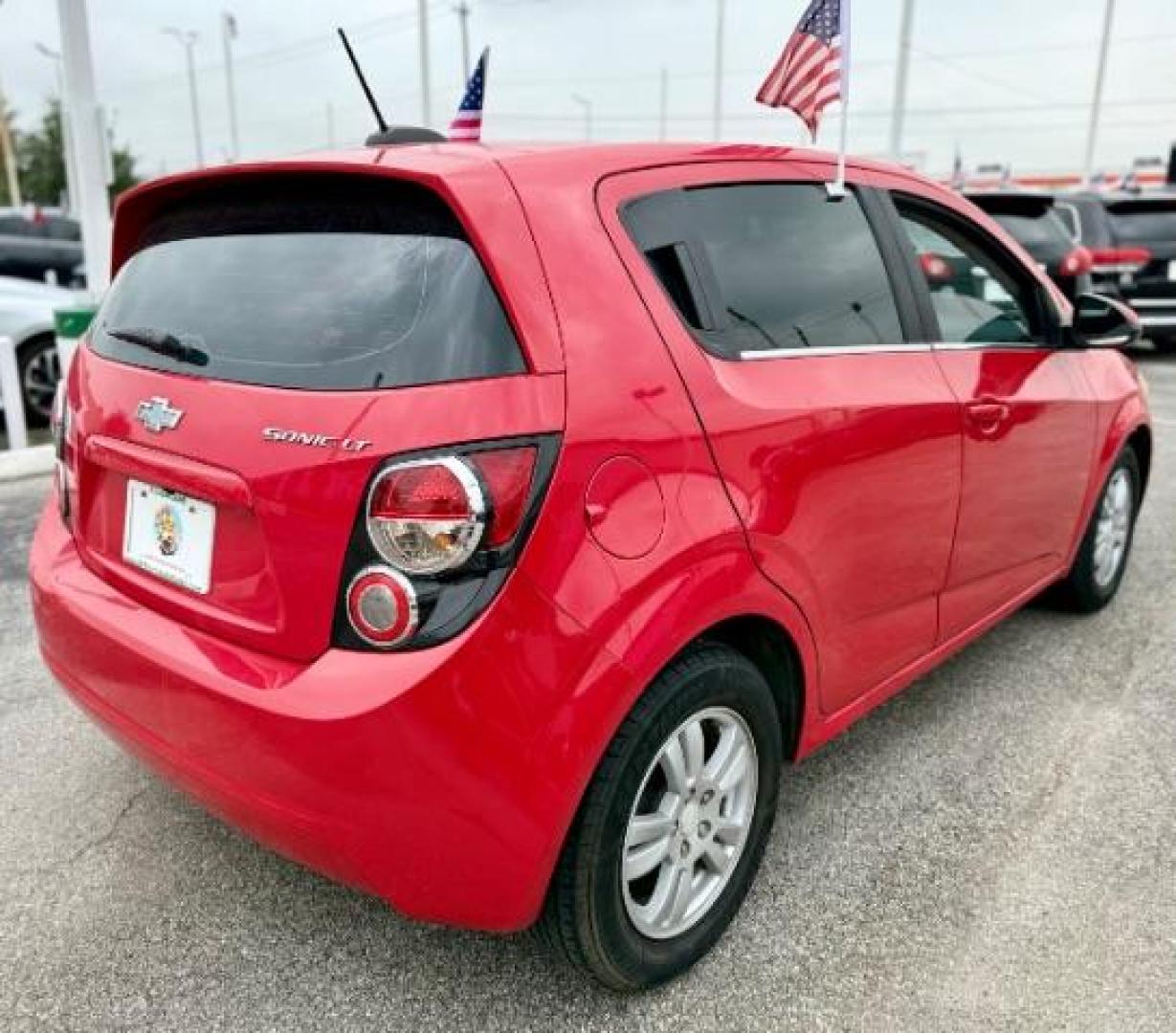 2016 RED Chevrolet Sonic LT Auto 5-Door (1G1JC6SH9G4) with an 1.8L L4 DOHC 24V engine, 6-Speed Automatic transmission, located at 4545 Spencer Hwy., Pasadena, 77504, (832) 266-1645, 29.666037, -95.173775 - Photo#5