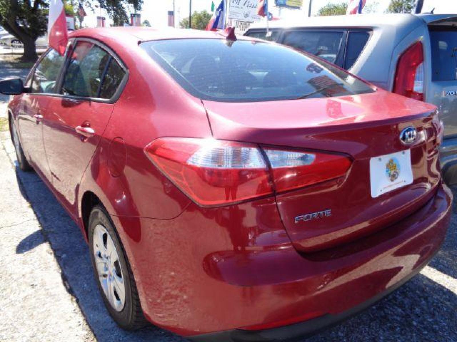 2016 Crimson Red /Black, cloth Kia Forte LX w/Popular Package (KNAFK4A60G5) with an 1.8L L4 DOHC 16V engine, located at 7935 Gulf Freeway, Houston, 77017, (832) 266-1645, 29.684393, -95.275665 - Photo #3