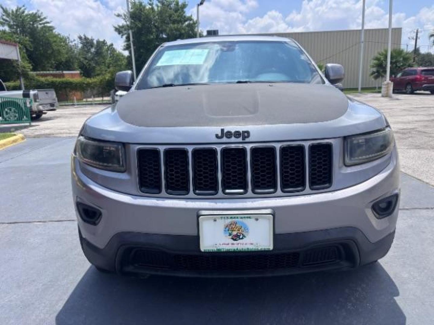 2014 Billet Silver Metallic CC /Black Jeep Grand Cherokee Laredo 2WD (1C4RJEAG0EC) with an 3.6L V6 DOHC 24V engine, 5-Speed Automatic transmission, located at 4545 Spencer Hwy., Pasadena, 77504, (832) 266-1645, 29.666037, -95.173775- Photo#1