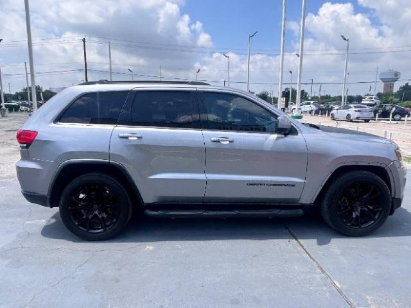 2014 Billet Silver Metallic CC /Black Jeep Grand Cherokee Laredo 2WD (1C4RJEAG0EC) with an 3.6L V6 DOHC 24V engine, 5-Speed Automatic transmission, located at 4545 Spencer Hwy., Pasadena, 77504, (832) 266-1645, 29.666037, -95.173775- Photo#7