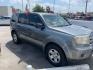 2009 Sterling Gray Metall Honda Pilot LX 2WD (5FNYF38249B) with an 3.5L V6 SOHC 24V engine, 5-Speed Automatic transmission, located at 4545 Spencer Hwy., Pasadena, 77504, (832) 266-1645, 29.666037, -95.173775 - Photo#2