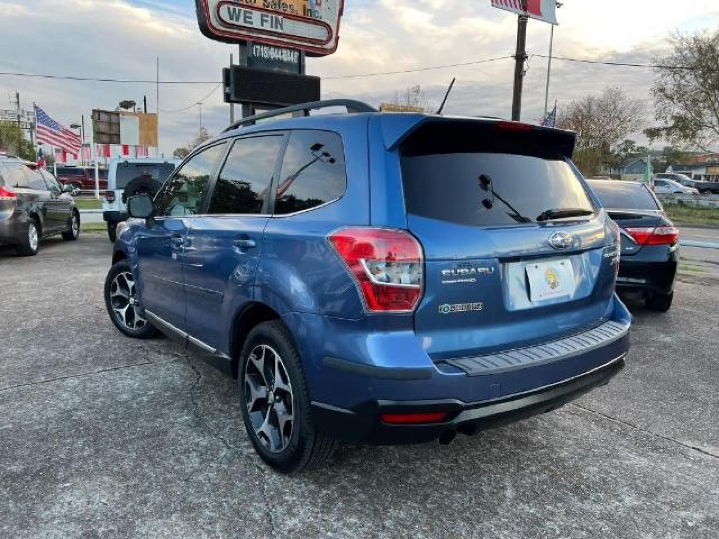 2015 Quartz Blue Pearl Subaru Forester 2.0XT Touring (JF2SJGWC3FH) with an 2.0L H4 SOHC 16V engine, Continuously Variable Transmission transmission, located at 7935 Gulf Freeway, Houston, 77017, (832) 266-1645, 29.684393, -95.275665 - Photo#4