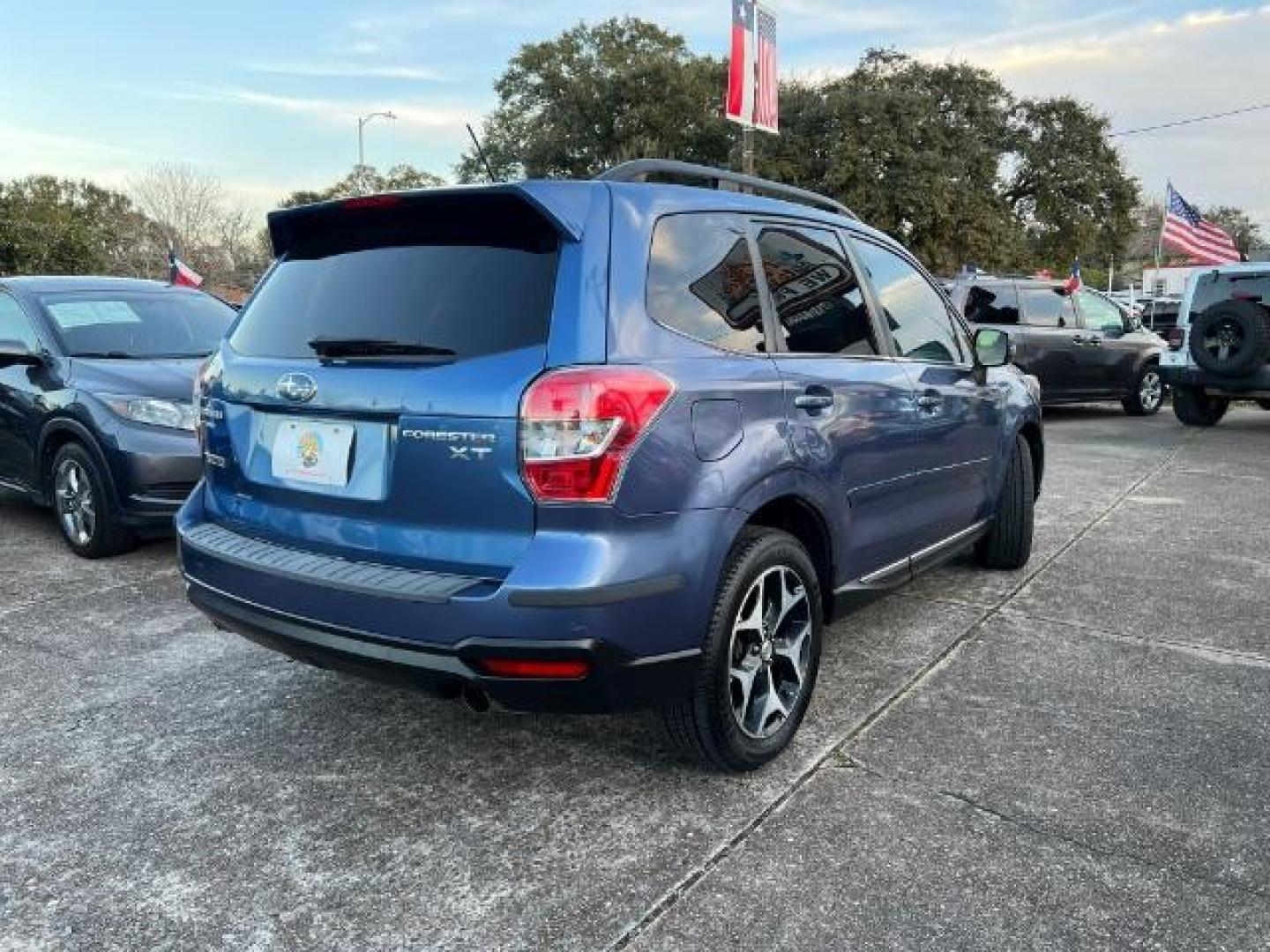2015 Quartz Blue Pearl Subaru Forester 2.0XT Touring (JF2SJGWC3FH) with an 2.0L H4 SOHC 16V engine, Continuously Variable Transmission transmission, located at 7935 Gulf Freeway, Houston, 77017, (832) 266-1645, 29.684393, -95.275665 - Photo#6