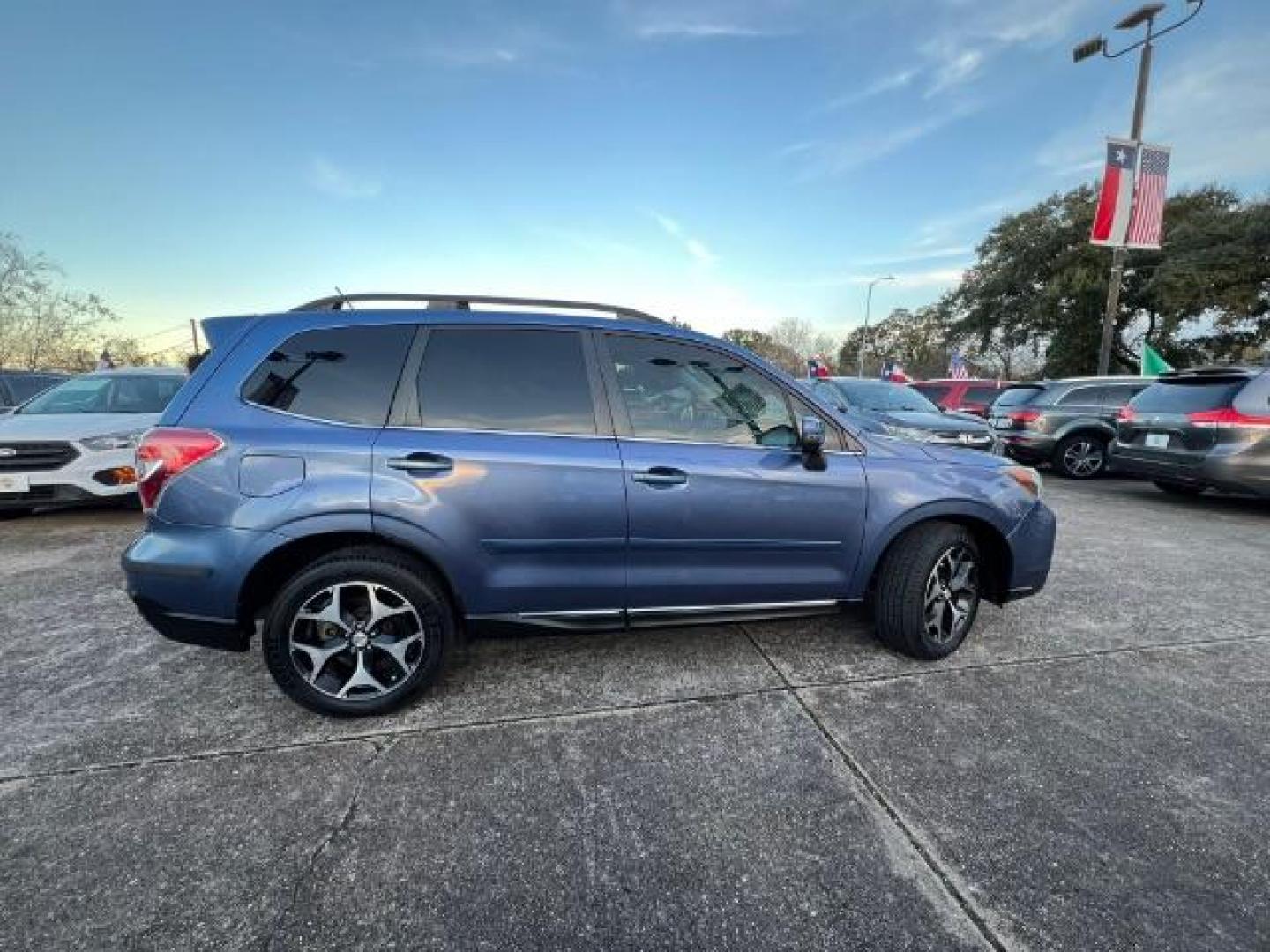 2015 Quartz Blue Pearl Subaru Forester 2.0XT Touring (JF2SJGWC3FH) with an 2.0L H4 SOHC 16V engine, Continuously Variable Transmission transmission, located at 7935 Gulf Freeway, Houston, 77017, (832) 266-1645, 29.684393, -95.275665 - Photo#7