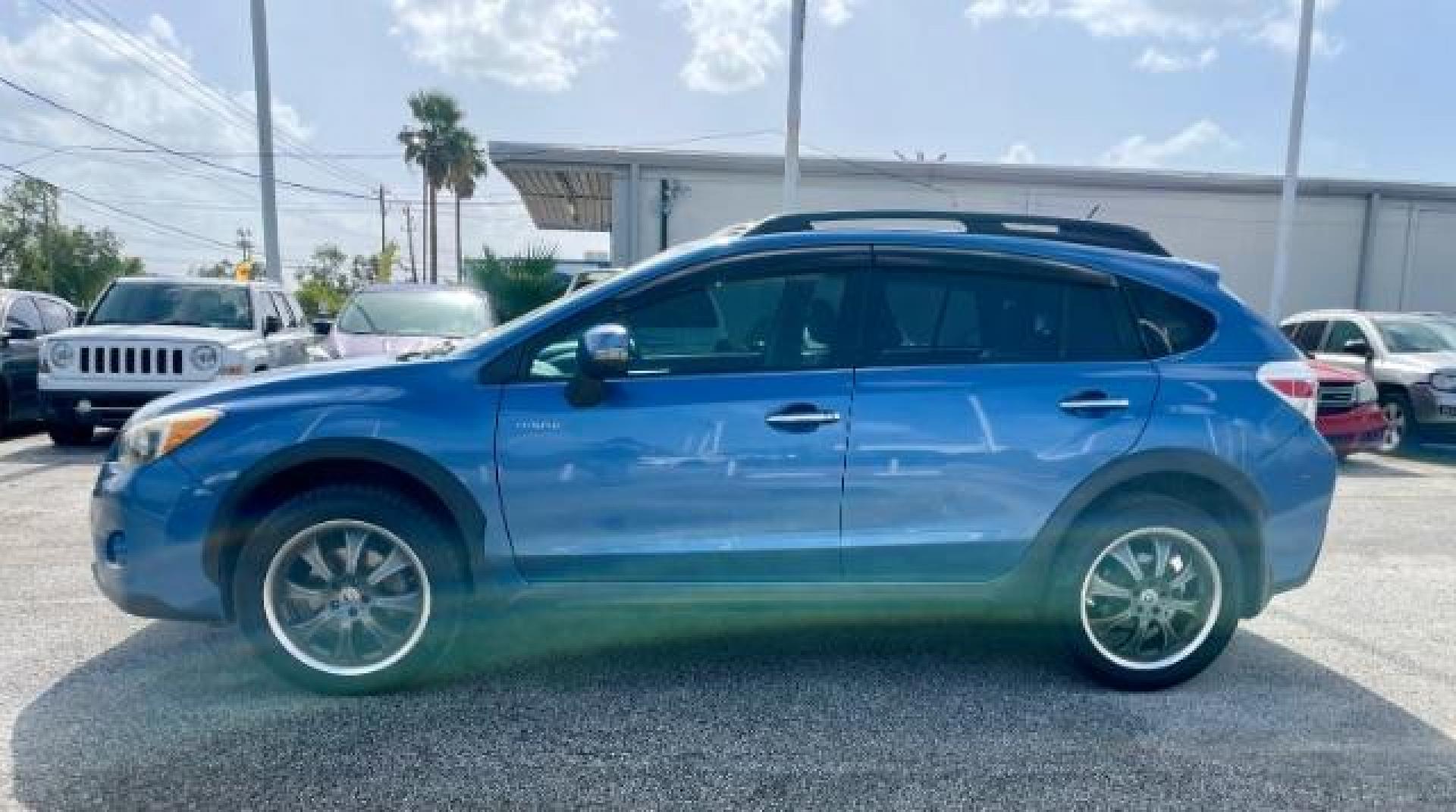 2014 Quartz Blue Pearl Subaru XV Crosstrek Hybrid 2.0i Touring (JF2GPBKC8EH) with an 2.0L L4 DOHC 16V HYBRID engine, Continuously Variable Transmission transmission, located at 4545 Spencer Hwy., Pasadena, 77504, (832) 266-1645, 29.666037, -95.173775 - Photo#2