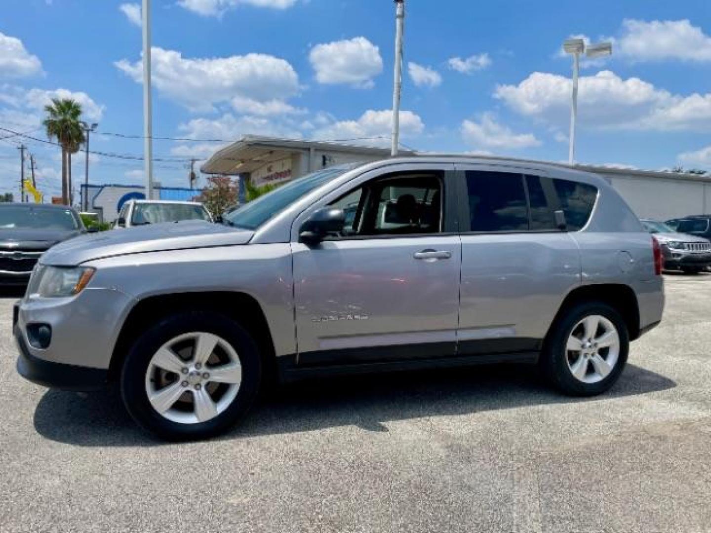 2016 Silver /Black Jeep Compass Sport FWD (1C4NJCBAXGD) with an 2.0L L4 DOHC 16V engine, located at 4545 Spencer Hwy., Pasadena, 77504, (832) 266-1645, 29.666037, -95.173775 - Photo#1