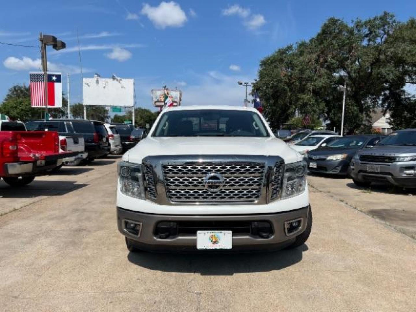 2017 Glacier White Nissan Titan Platinum Reserve Crew Cab 2WD (1N6AA1E6XHN) with an 5.6L V8 DOHC 32V engine, 6-Speed Automatic transmission, located at 7935 Gulf Freeway, Houston, 77017, (832) 266-1645, 29.684393, -95.275665 - Photo#1