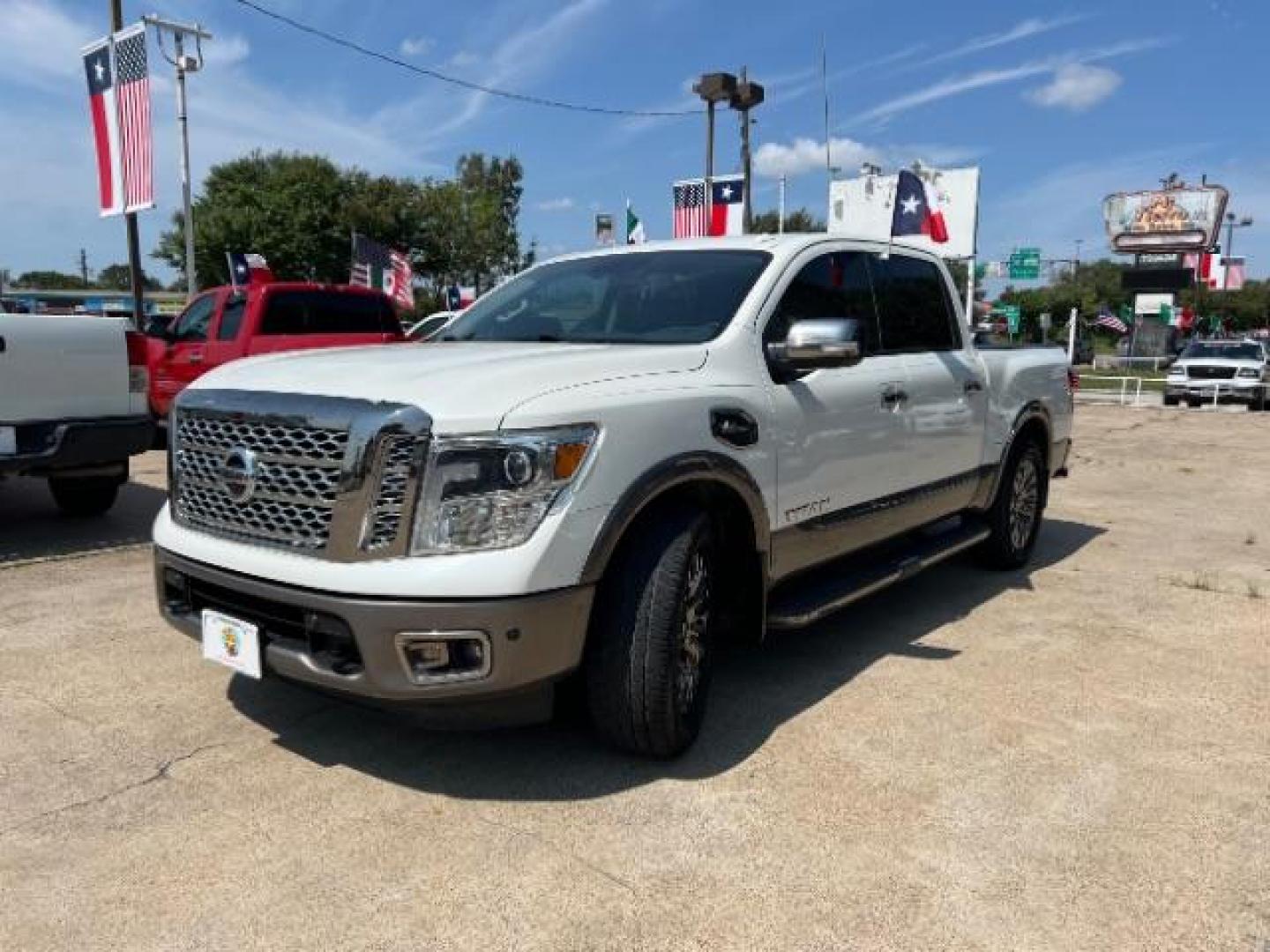 2017 Glacier White Nissan Titan Platinum Reserve Crew Cab 2WD (1N6AA1E6XHN) with an 5.6L V8 DOHC 32V engine, 6-Speed Automatic transmission, located at 7935 Gulf Freeway, Houston, 77017, (832) 266-1645, 29.684393, -95.275665 - Photo#2