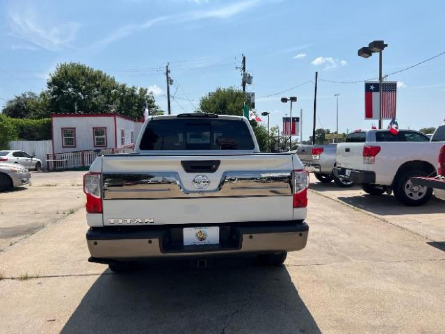 2017 Glacier White Nissan Titan Platinum Reserve Crew Cab 2WD (1N6AA1E6XHN) with an 5.6L V8 DOHC 32V engine, 6-Speed Automatic transmission, located at 7935 Gulf Freeway, Houston, 77017, (832) 266-1645, 29.684393, -95.275665 - Photo#5