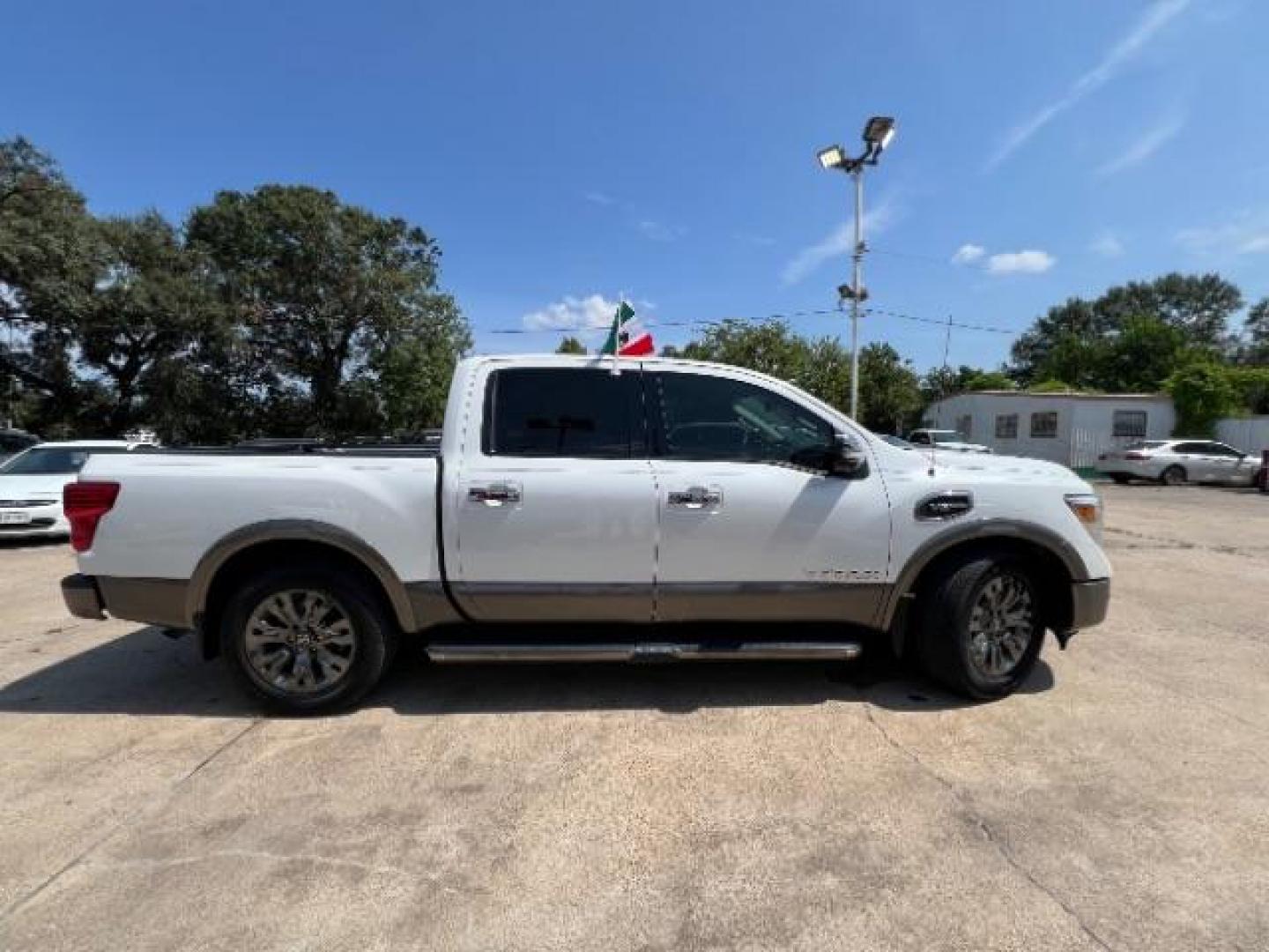 2017 Glacier White Nissan Titan Platinum Reserve Crew Cab 2WD (1N6AA1E6XHN) with an 5.6L V8 DOHC 32V engine, 6-Speed Automatic transmission, located at 7935 Gulf Freeway, Houston, 77017, (832) 266-1645, 29.684393, -95.275665 - Photo#7