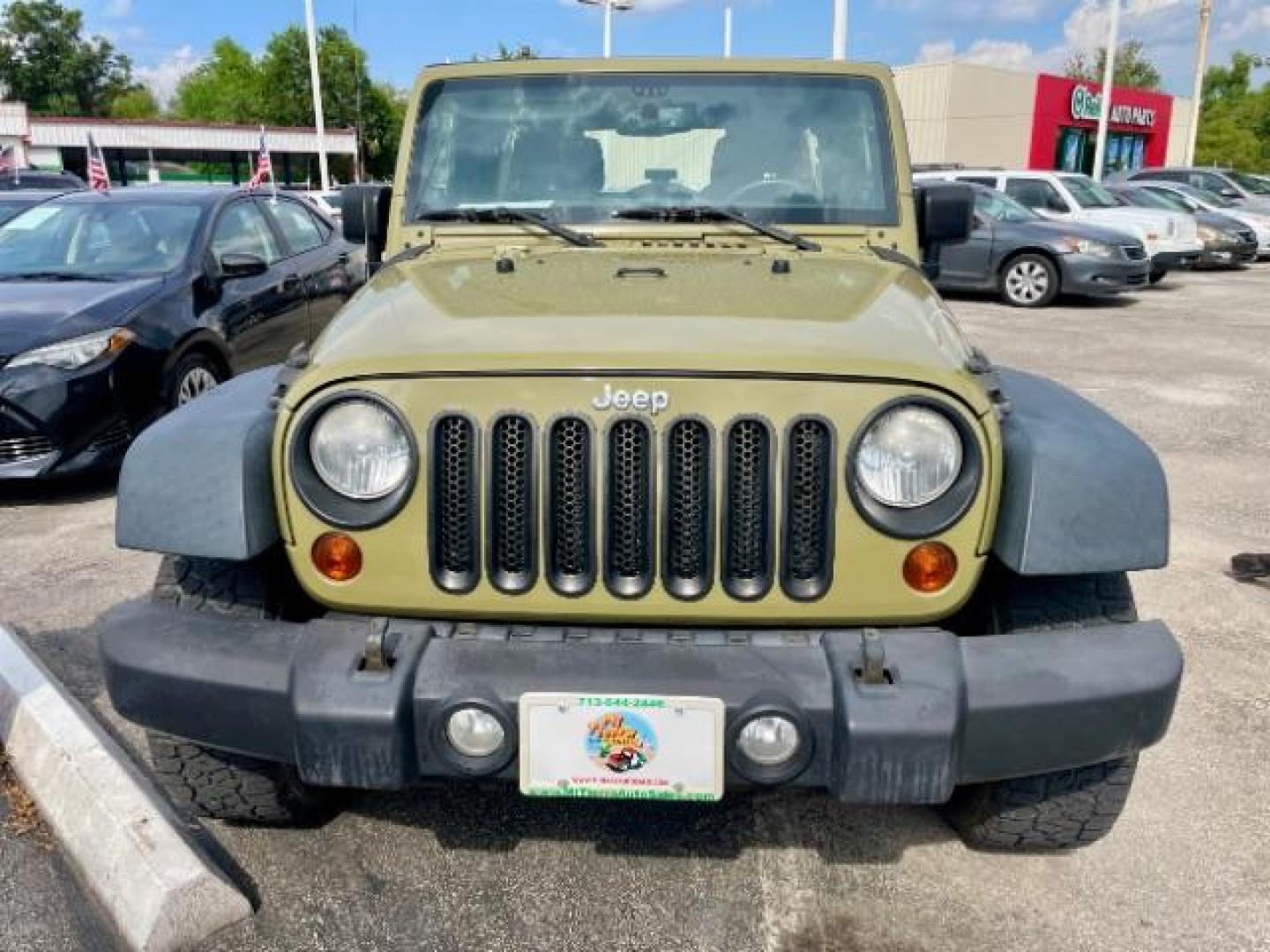 2013 OLIVE GREEN Jeep Wrangler Unlimited Sport 4WD (1C4BJWDG0DL) with an 3.6L V6 DOHC 24V FFV engine, located at 4545 Spencer Hwy., Pasadena, 77504, (832) 266-1645, 29.666037, -95.173775 - Photo#0