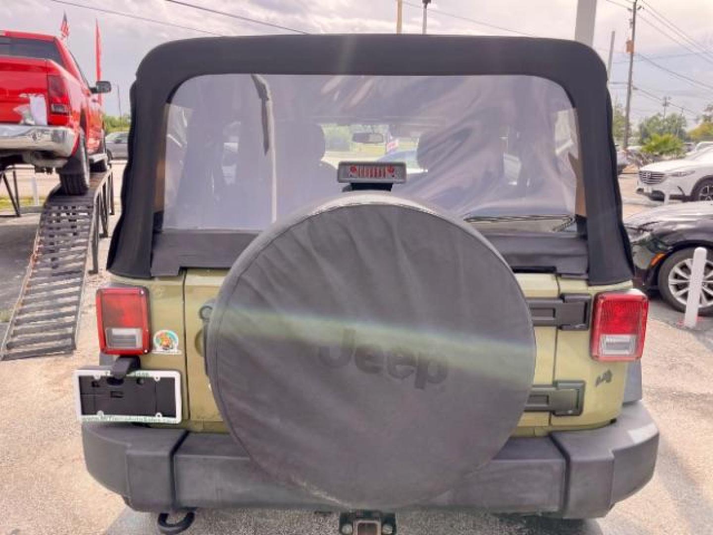 2013 OLIVE GREEN Jeep Wrangler Unlimited Sport 4WD (1C4BJWDG0DL) with an 3.6L V6 DOHC 24V FFV engine, located at 4545 Spencer Hwy., Pasadena, 77504, (832) 266-1645, 29.666037, -95.173775 - Photo#2