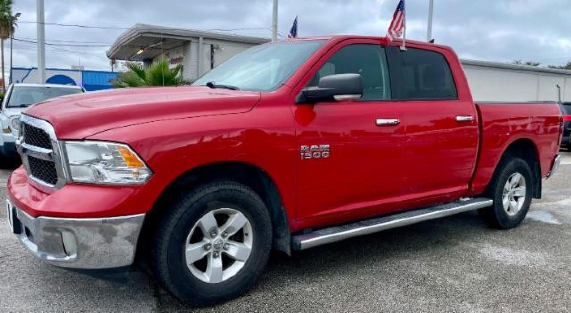 2017 Flame Red Clear Coat /Black/Diesel Gray, cloth RAM 1500 SLT Crew Cab SWB 4WD (1C6RR7LG4HS) with an 3.6L V6 DOHC 24V FFV engine, 8-Speed Automatic transmission, located at 4545 Spencer Hwy., Pasadena, 77504, (832) 266-1645, 29.666037, -95.173775 - Photo#1