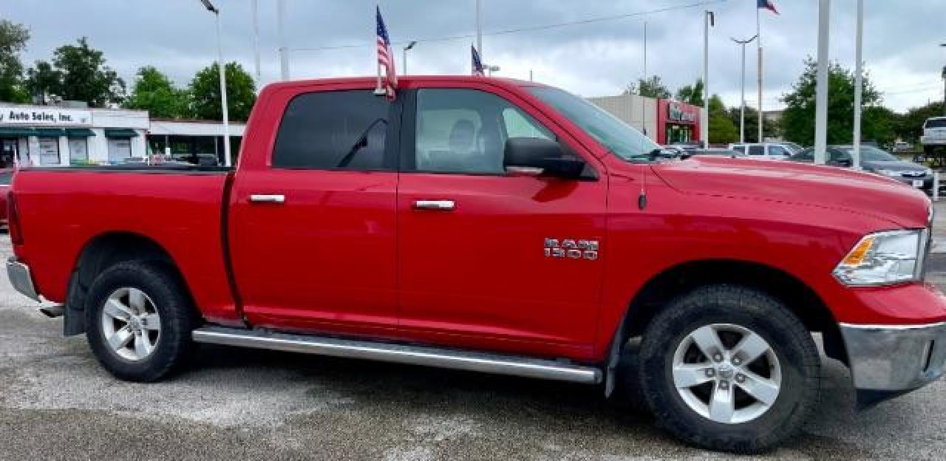 2017 Flame Red Clear Coat /Black/Diesel Gray, cloth RAM 1500 SLT Crew Cab SWB 4WD (1C6RR7LG4HS) with an 3.6L V6 DOHC 24V FFV engine, 8-Speed Automatic transmission, located at 4545 Spencer Hwy., Pasadena, 77504, (832) 266-1645, 29.666037, -95.173775 - Photo#2