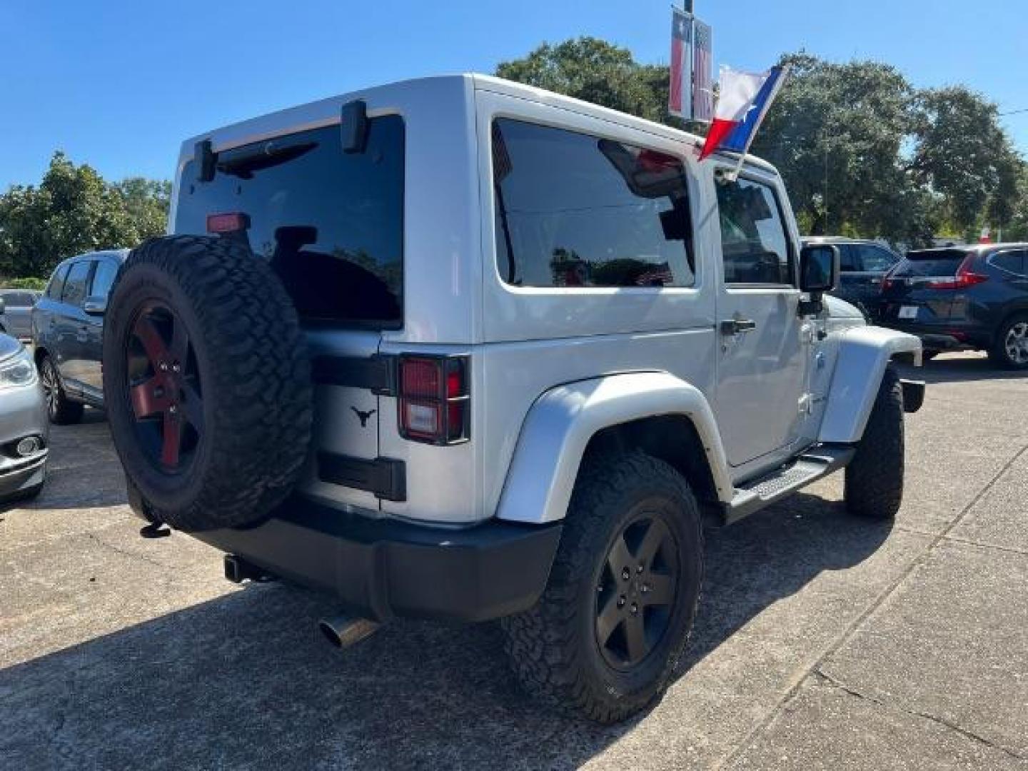 2012 Bright Silver Metallic with Black Soft Top Jeep Wrangler Sahara 4WD (1C4AJWBG1CL) with an 3.6L V6 DOHC 24V FFV engine, 5-Speed Automatic transmission, located at 7935 Gulf Freeway, Houston, 77017, (832) 266-1645, 29.684393, -95.275665 - Photo#6