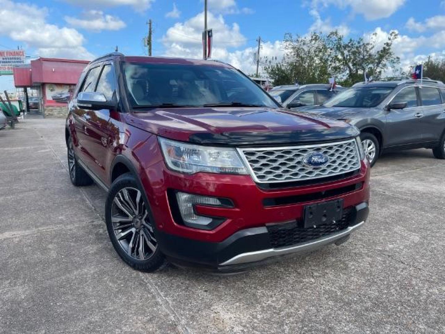 2016 Ruby Red Metallic Tinted Clearcoat Ford Explorer Platinum AWD (1FM5K8HT0GG) with an 3.5L V6 DOHC 24V engine, 6-Speed Automatic transmission, located at 7935 Gulf Freeway, Houston, 77017, (832) 266-1645, 29.684393, -95.275665 - Photo#0