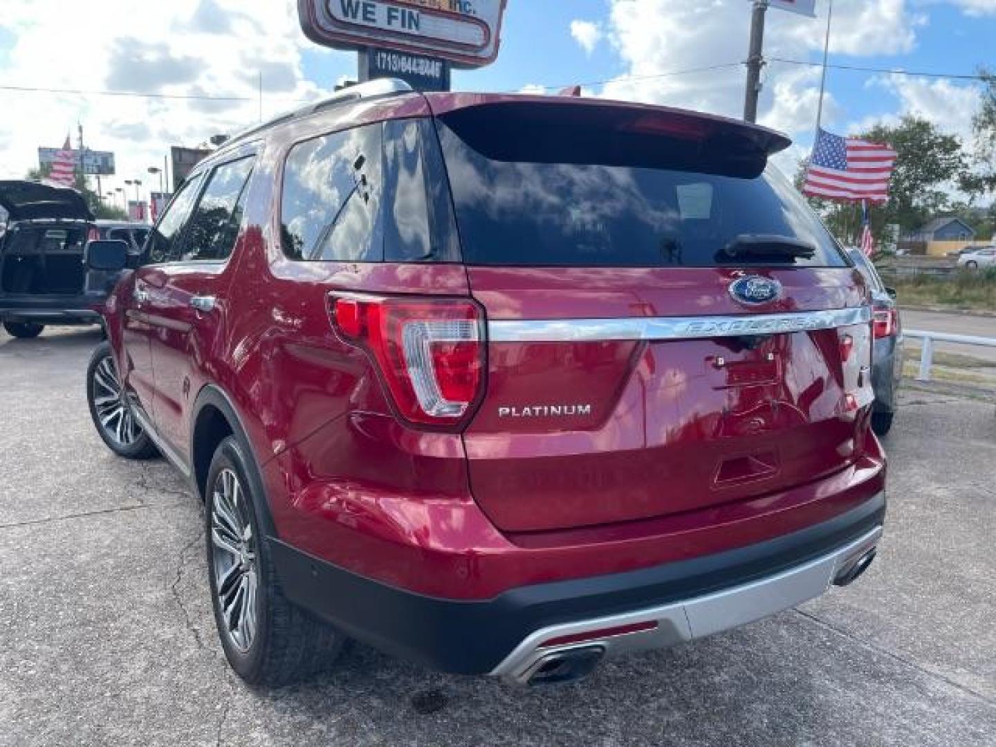 2016 Ruby Red Metallic Tinted Clearcoat Ford Explorer Platinum AWD (1FM5K8HT0GG) with an 3.5L V6 DOHC 24V engine, 6-Speed Automatic transmission, located at 7935 Gulf Freeway, Houston, 77017, (832) 266-1645, 29.684393, -95.275665 - Photo#4