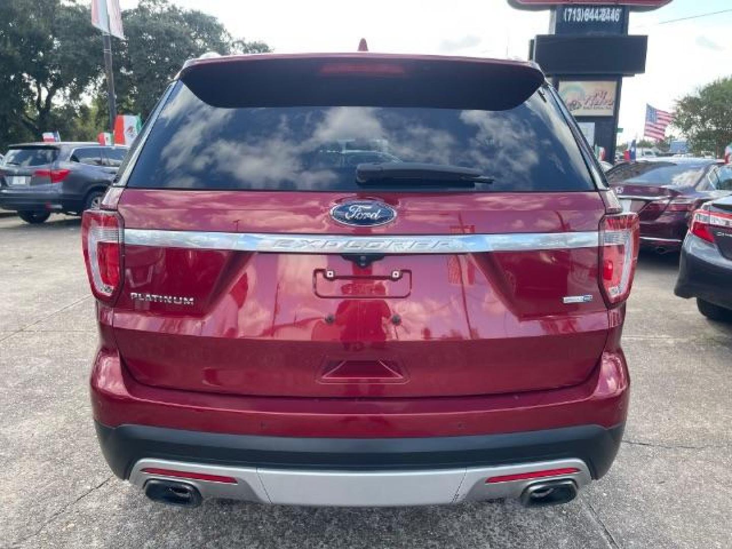 2016 Ruby Red Metallic Tinted Clearcoat Ford Explorer Platinum AWD (1FM5K8HT0GG) with an 3.5L V6 DOHC 24V engine, 6-Speed Automatic transmission, located at 7935 Gulf Freeway, Houston, 77017, (832) 266-1645, 29.684393, -95.275665 - Photo#5