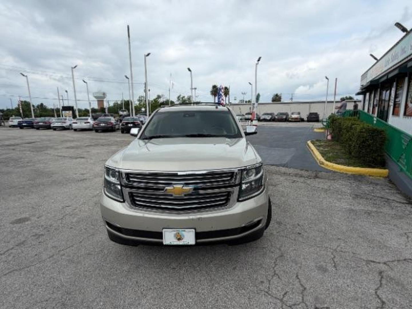 2015 CASHMERE METALLIC /brown Chevrolet Suburban LTZ 1500 4WD (1GNSKKKC4FR) with an 5.3L V8 OHV 16V engine, 6-Speed Automatic transmission, located at 4545 Spencer Hwy., Pasadena, 77504, (832) 266-1645, 29.666037, -95.173775 - Photo#1