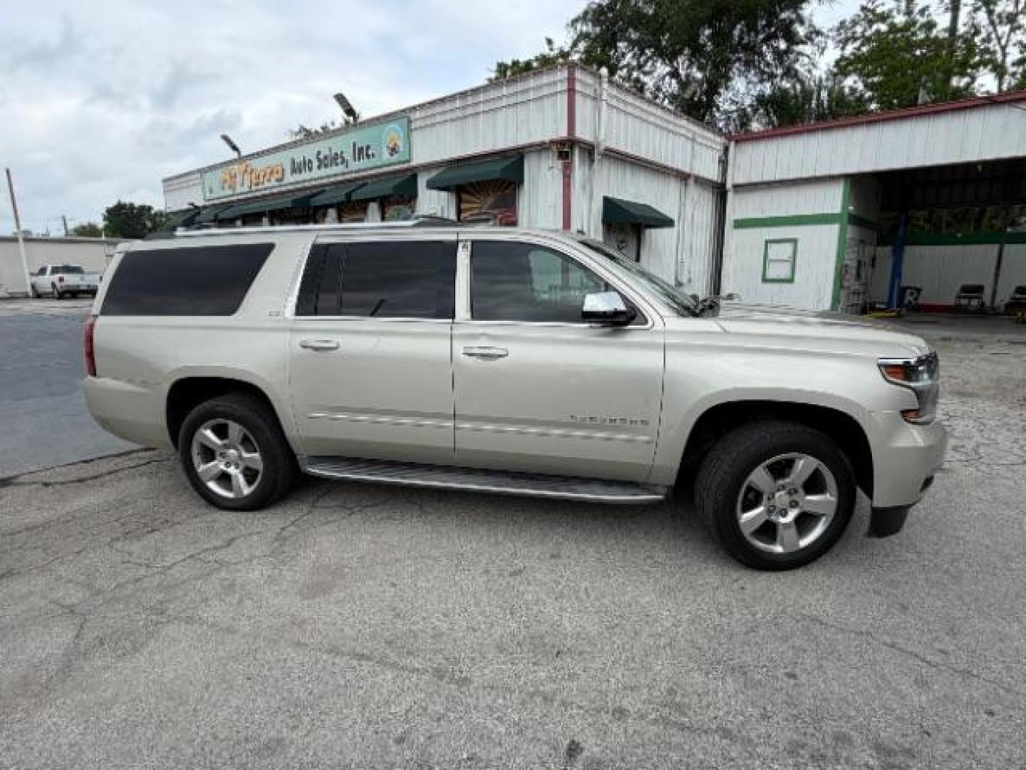 2015 CASHMERE METALLIC /brown Chevrolet Suburban LTZ 1500 4WD (1GNSKKKC4FR) with an 5.3L V8 OHV 16V engine, 6-Speed Automatic transmission, located at 4545 Spencer Hwy., Pasadena, 77504, (832) 266-1645, 29.666037, -95.173775 - Photo#2