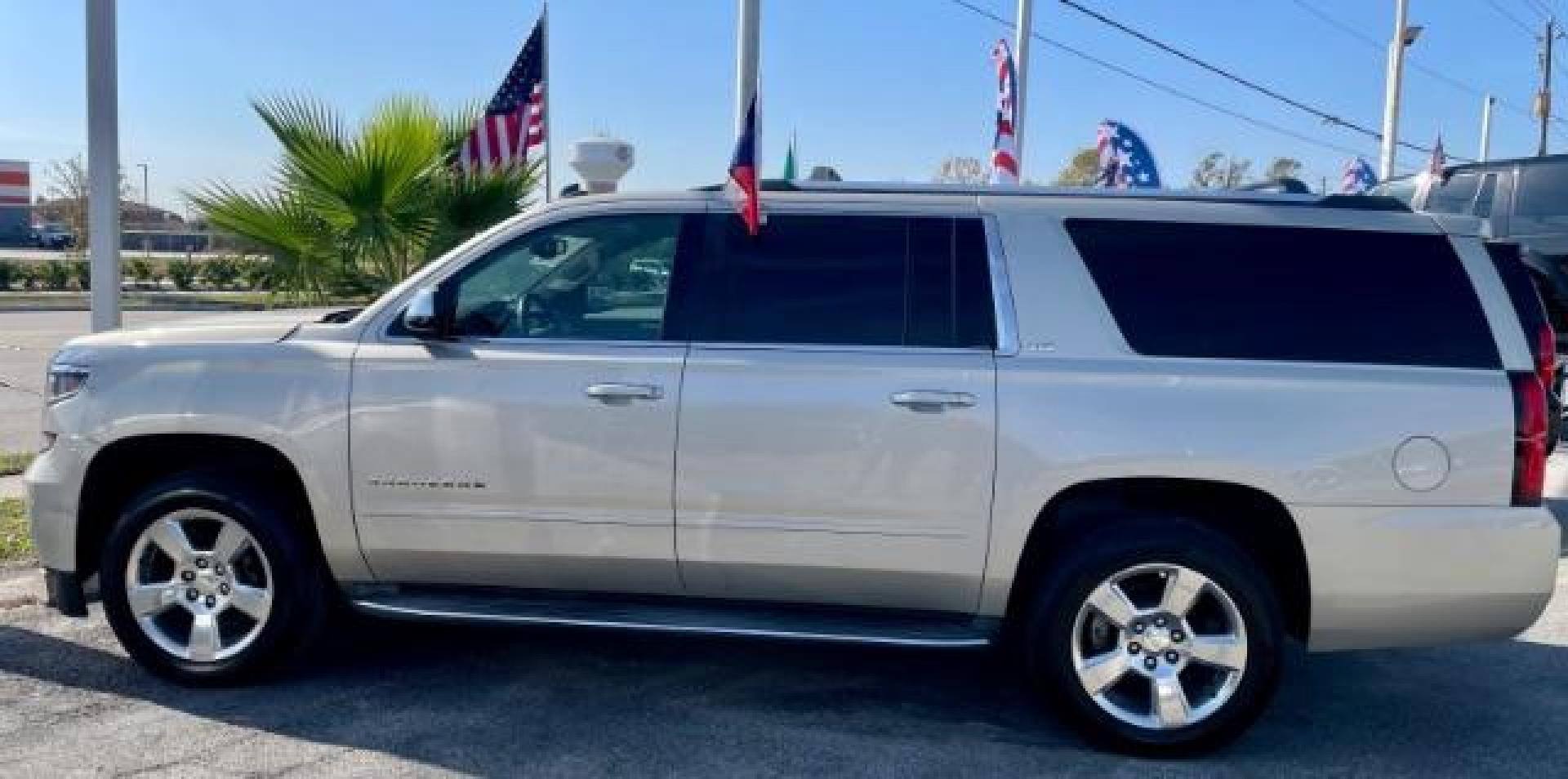 2015 CASHMERE METALLIC /brown Chevrolet Suburban LTZ 1500 4WD (1GNSKKKC4FR) with an 5.3L V8 OHV 16V engine, 6-Speed Automatic transmission, located at 4545 Spencer Hwy., Pasadena, 77504, (832) 266-1645, 29.666037, -95.173775 - Photo#1