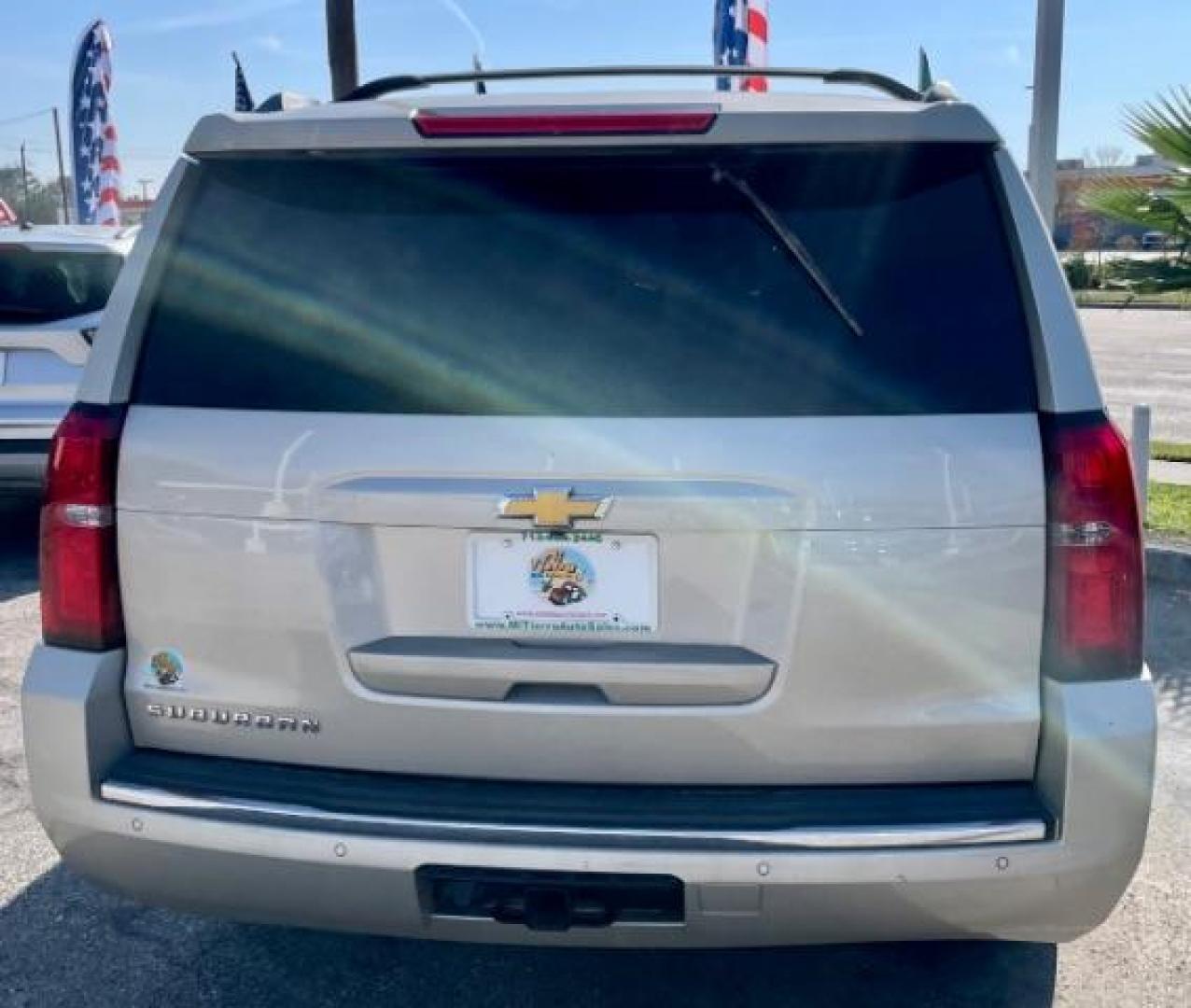 2015 CASHMERE METALLIC /brown Chevrolet Suburban LTZ 1500 4WD (1GNSKKKC4FR) with an 5.3L V8 OHV 16V engine, 6-Speed Automatic transmission, located at 4545 Spencer Hwy., Pasadena, 77504, (832) 266-1645, 29.666037, -95.173775 - Photo#2