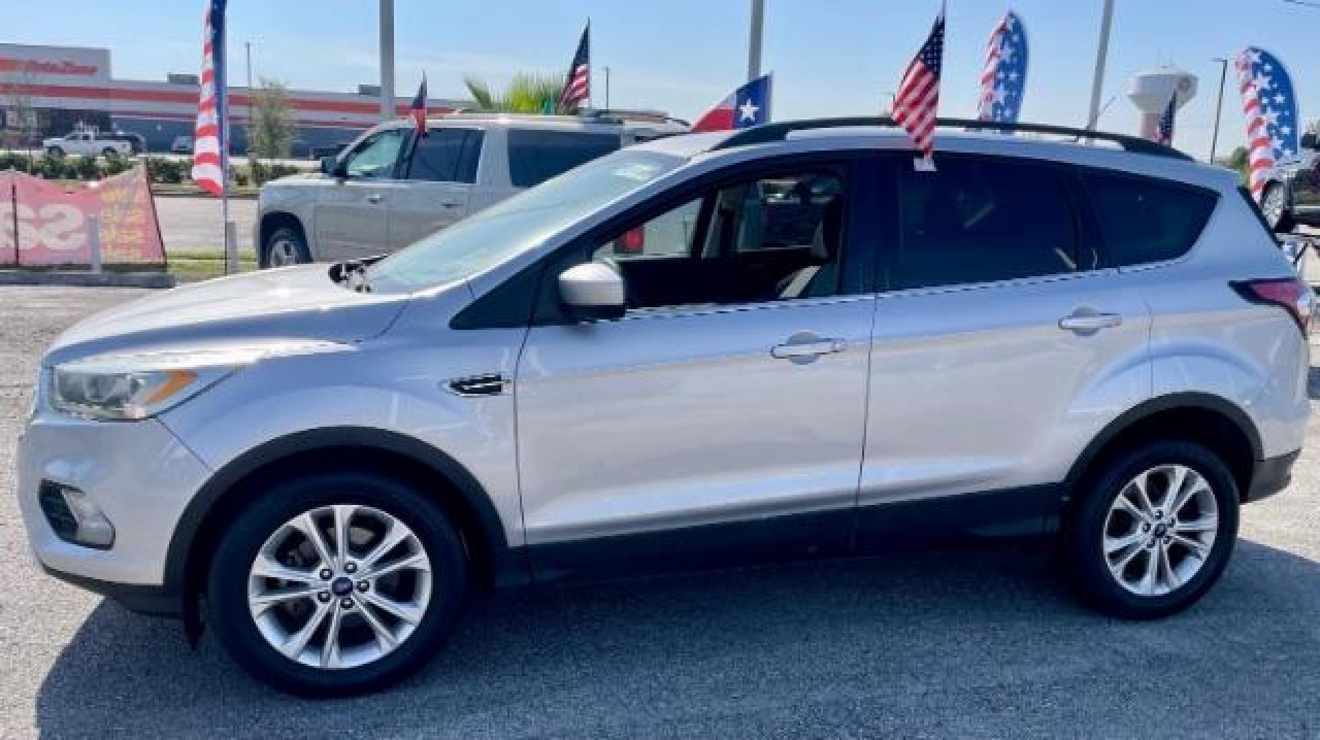 2017 Ingot Silver Metallic /Medium Light Stone, cloth Ford Escape SE FWD (1FMCU0GD5HU) with an 1.5L L4 DOHC 16V engine, 6-Speed Automatic transmission, located at 4545 Spencer Hwy., Pasadena, 77504, (832) 266-1645, 29.666037, -95.173775 - Photo#0