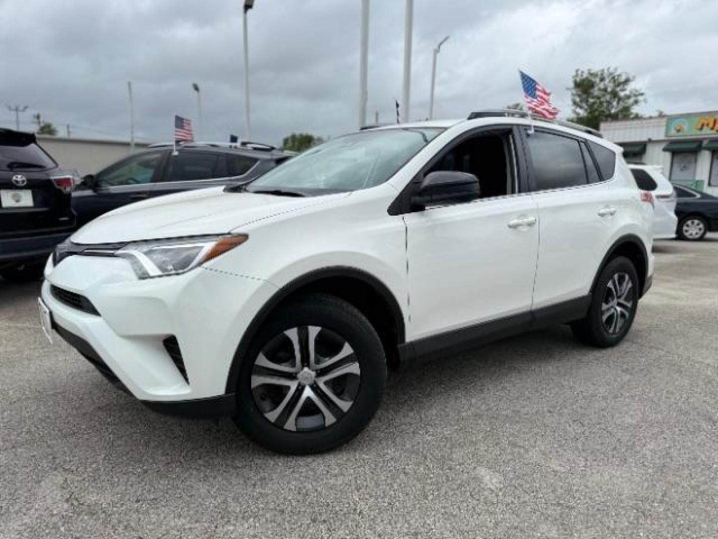 2017 Super White /Black Toyota RAV4 LE (JTMZFREV7HJ) with an 2.5L I-4 DOHC engine, located at 4545 Spencer Hwy., Pasadena, 77504, (832) 266-1645, 29.666037, -95.173775 - Photo#0