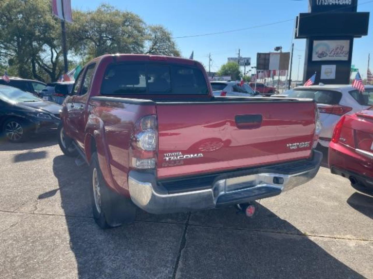 2011 Barcelona Red Metallic Toyota Tacoma PreRunner V6 (3TMJU4GNXBM) with an 4L V-6 DOHC engine, located at 7935 Gulf Freeway, Houston, 77017, (832) 266-1645, 29.684393, -95.275665 - Photo#4