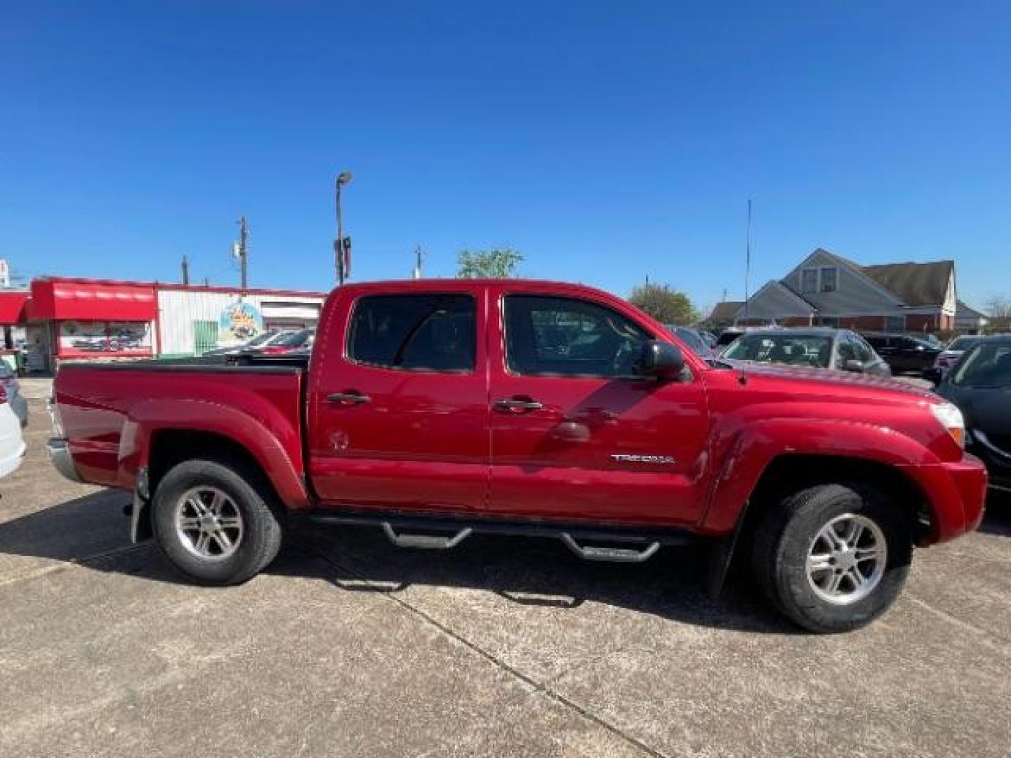 2011 Barcelona Red Metallic Toyota Tacoma PreRunner V6 (3TMJU4GNXBM) with an 4L V-6 DOHC engine, located at 7935 Gulf Freeway, Houston, 77017, (832) 266-1645, 29.684393, -95.275665 - Photo#6