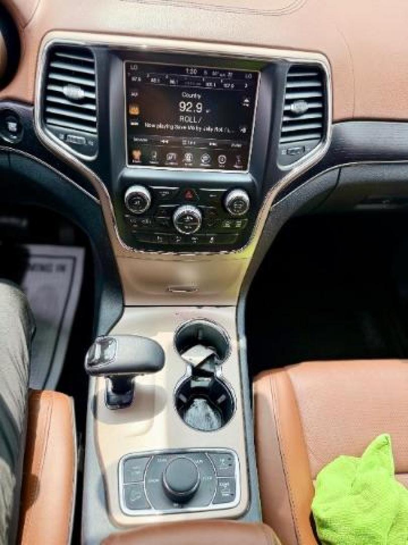2015 Brilliant Black Crystal Pearlcoat /Black/Dark Sienna Brown Jeep Grand Cherokee Summit (1C4RJFJG4FC) with an 3.6L V-6 DOHC engine, located at 4545 Spencer Hwy., Pasadena, 77504, (832) 266-1645, 29.666037, -95.173775 - Photo#11