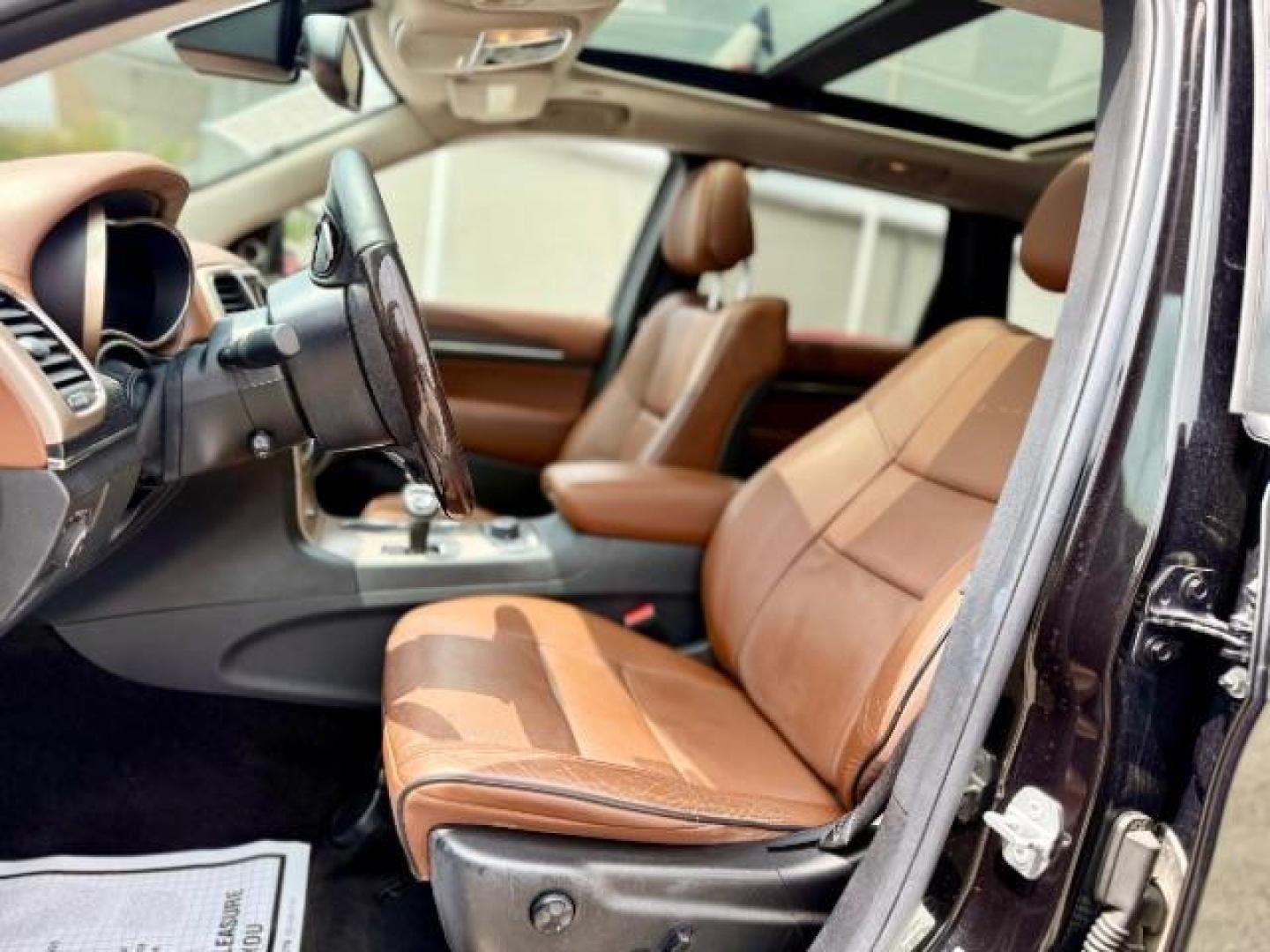 2015 Brilliant Black Crystal Pearlcoat /Black/Dark Sienna Brown Jeep Grand Cherokee Summit (1C4RJFJG4FC) with an 3.6L V-6 DOHC engine, located at 4545 Spencer Hwy., Pasadena, 77504, (832) 266-1645, 29.666037, -95.173775 - Photo#7