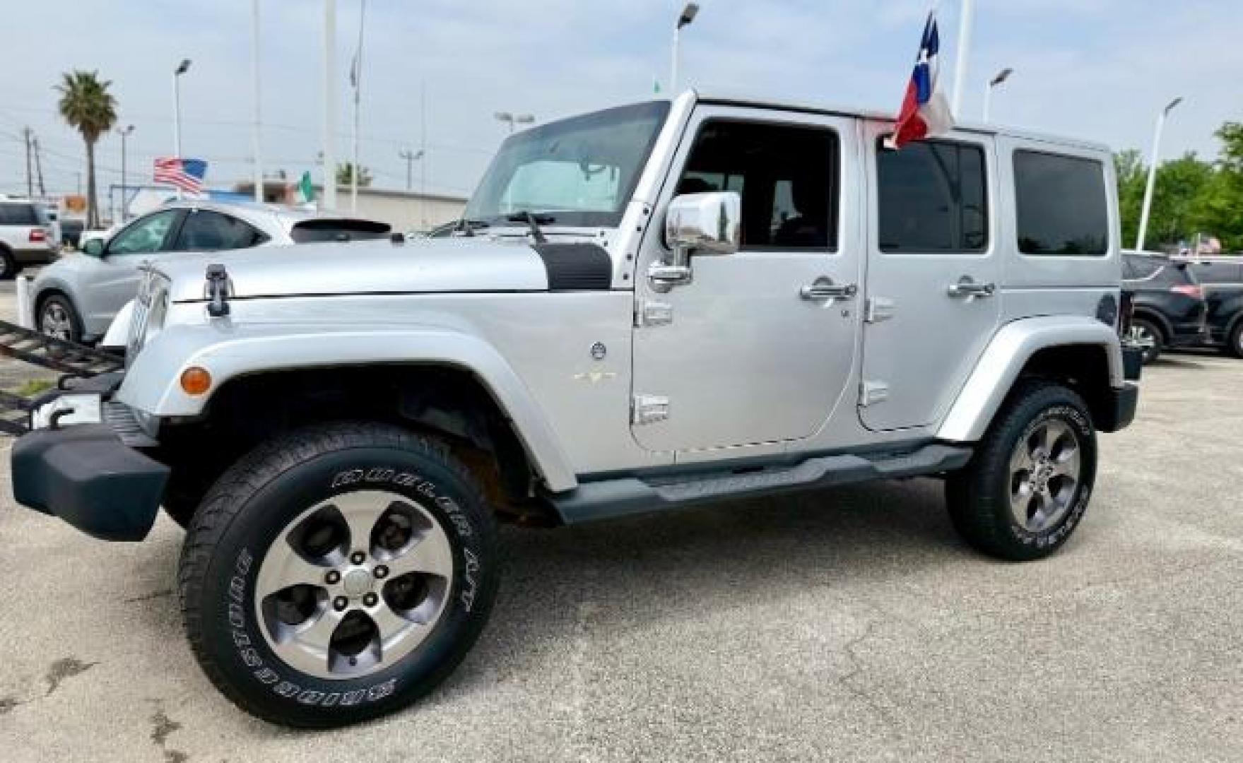 2012 Bright Silver Metallic Clearcoat /Dark Saddle/Black Jeep Wrangler Unlimited Sahara (1C4BJWEG5CL) with an 3.6L V-6 DOHC engine, located at 4545 Spencer Hwy., Pasadena, 77504, (832) 266-1645, 29.666037, -95.173775 - Photo#0