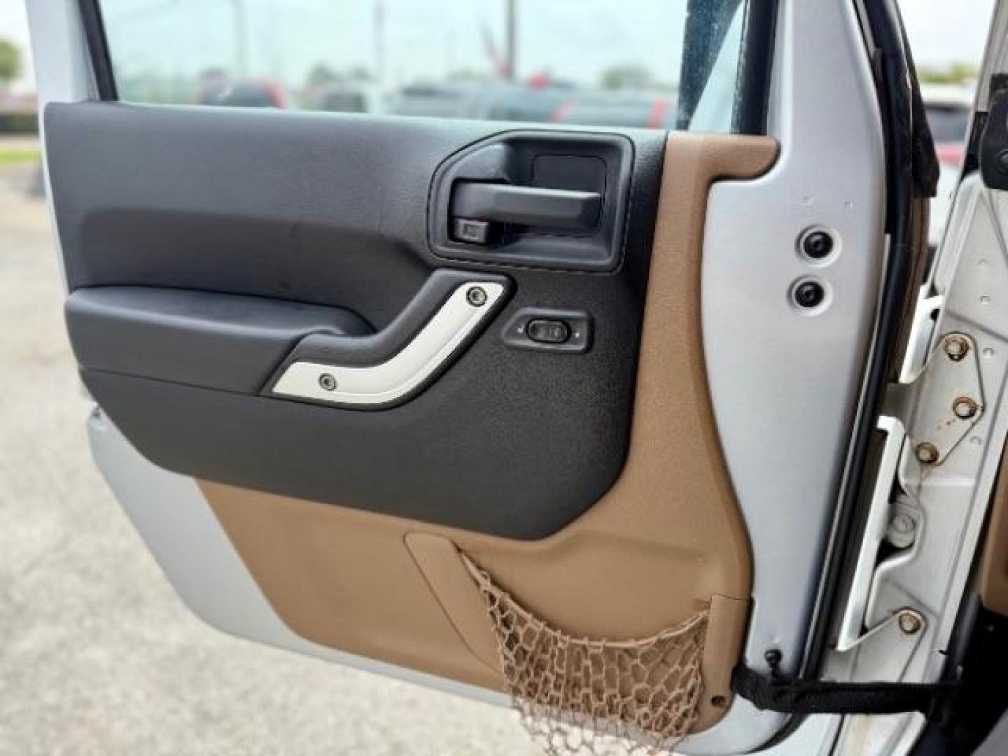 2012 Bright Silver Metallic Clearcoat /Dark Saddle/Black Jeep Wrangler Unlimited Sahara (1C4BJWEG5CL) with an 3.6L V-6 DOHC engine, located at 4545 Spencer Hwy., Pasadena, 77504, (832) 266-1645, 29.666037, -95.173775 - Photo#10