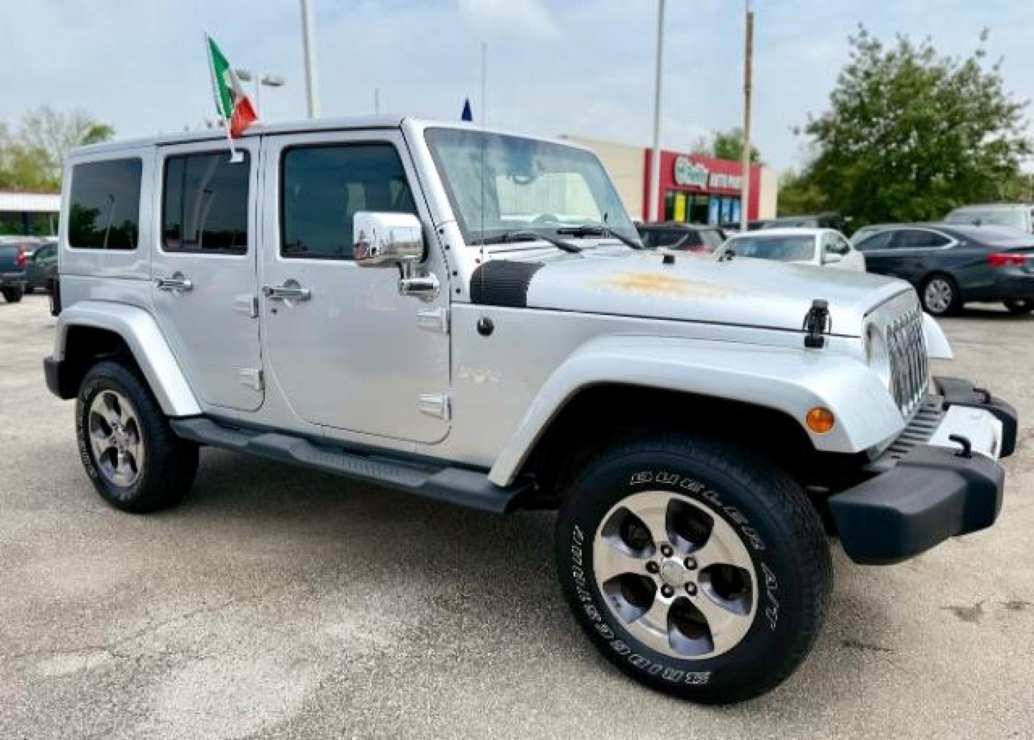 2012 Bright Silver Metallic Clearcoat /Dark Saddle/Black Jeep Wrangler Unlimited Sahara (1C4BJWEG5CL) with an 3.6L V-6 DOHC engine, located at 4545 Spencer Hwy., Pasadena, 77504, (832) 266-1645, 29.666037, -95.173775 - Photo#1