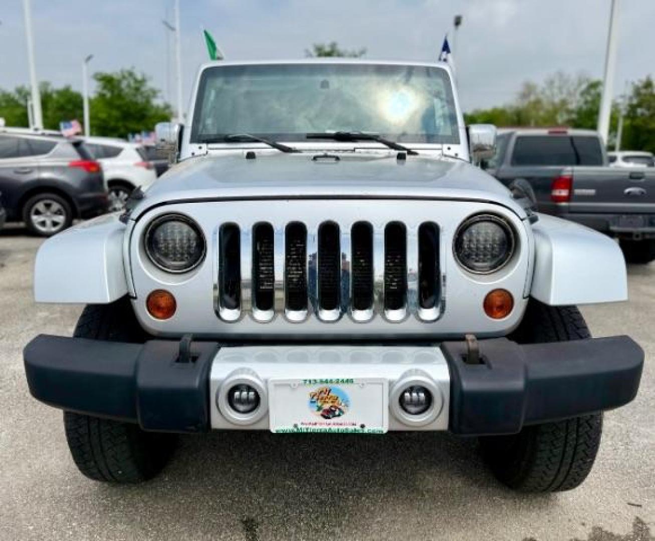 2012 Bright Silver Metallic Clearcoat /Dark Saddle/Black Jeep Wrangler Unlimited Sahara (1C4BJWEG5CL) with an 3.6L V-6 DOHC engine, located at 4545 Spencer Hwy., Pasadena, 77504, (832) 266-1645, 29.666037, -95.173775 - Photo#2