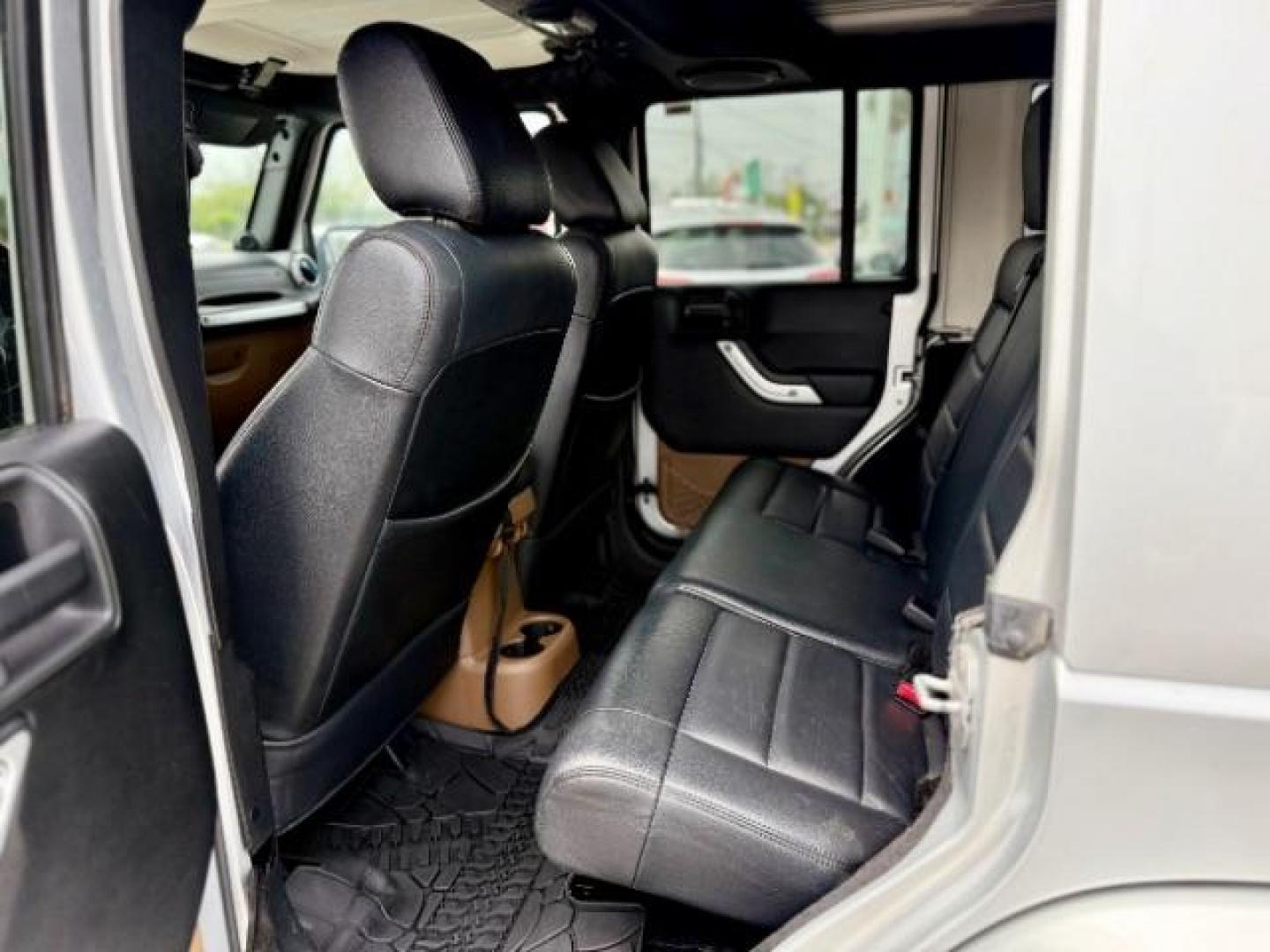 2012 Bright Silver Metallic Clearcoat /Dark Saddle/Black Jeep Wrangler Unlimited Sahara (1C4BJWEG5CL) with an 3.6L V-6 DOHC engine, located at 4545 Spencer Hwy., Pasadena, 77504, (832) 266-1645, 29.666037, -95.173775 - Photo#6