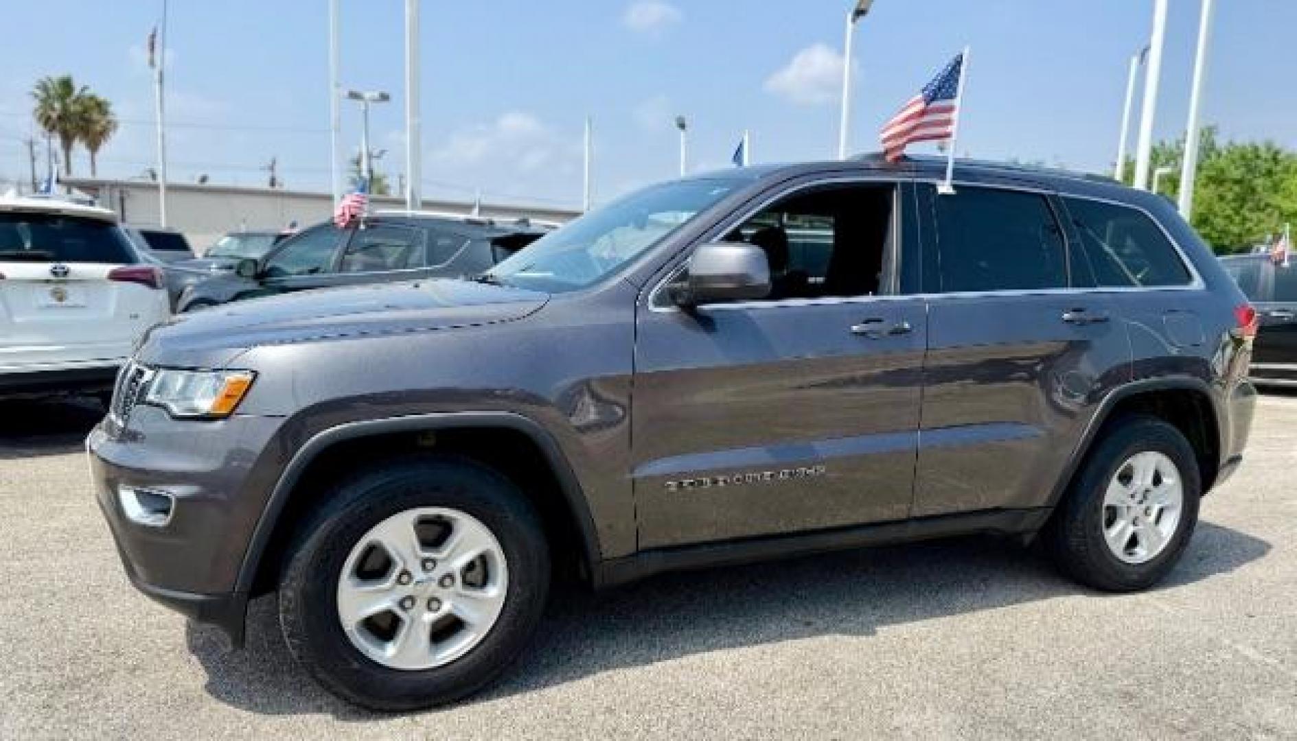 2017 Granite Crystal Metallic Clearcoat /Black Jeep Grand Cherokee Laredo 4x2 (1C4RJEAG8HC) with an Pentastar 3.6L V-6 DOHC engine, located at 4545 Spencer Hwy., Pasadena, 77504, (832) 266-1645, 29.666037, -95.173775 - Photo#0