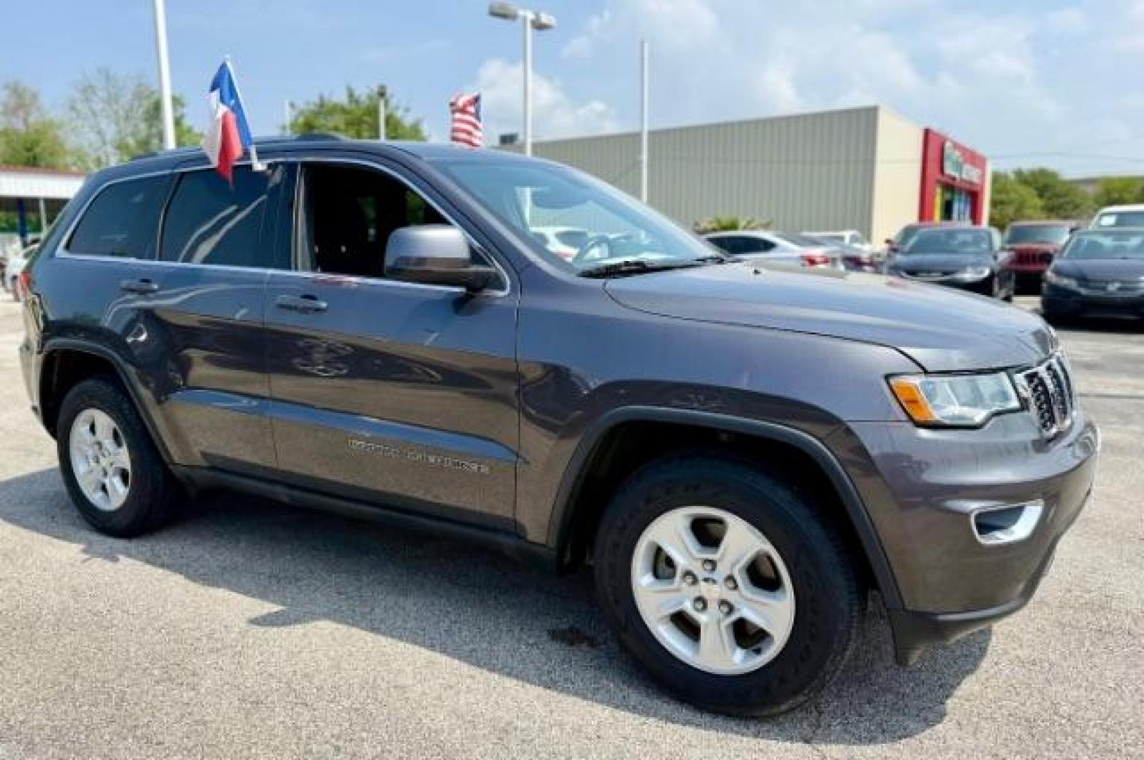 2017 Granite Crystal Metallic Clearcoat /Black Jeep Grand Cherokee Laredo 4x2 (1C4RJEAG8HC) with an Pentastar 3.6L V-6 DOHC engine, located at 4545 Spencer Hwy., Pasadena, 77504, (832) 266-1645, 29.666037, -95.173775 - Photo#1