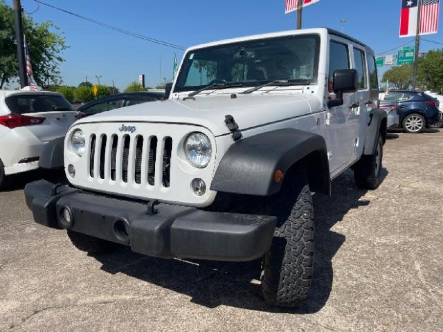 2016 Bright White Clearcoat Jeep Wrangler Unlimited Sport RHD (1C4BJWKG4GL) with an Pentastar 3.6L V-6 DOHC engine, located at 7935 Gulf Freeway, Houston, 77017, (832) 266-1645, 29.684393, -95.275665 - Photo#2