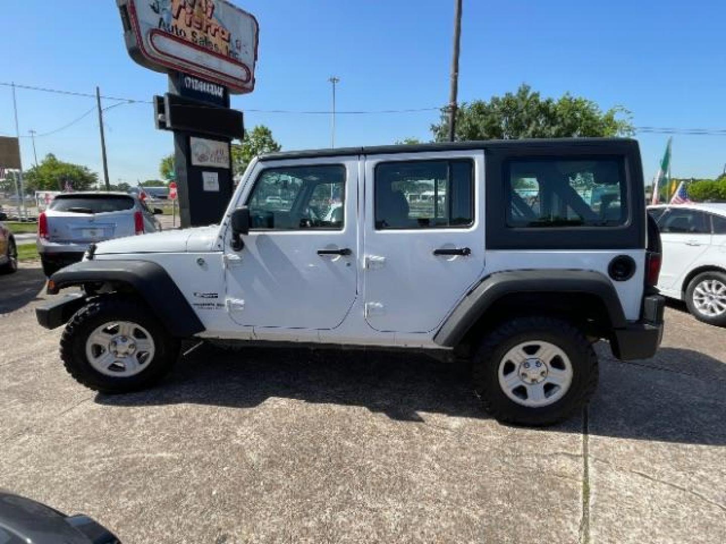 2016 Bright White Clearcoat Jeep Wrangler Unlimited Sport RHD (1C4BJWKG4GL) with an Pentastar 3.6L V-6 DOHC engine, located at 7935 Gulf Freeway, Houston, 77017, (832) 266-1645, 29.684393, -95.275665 - Photo#3