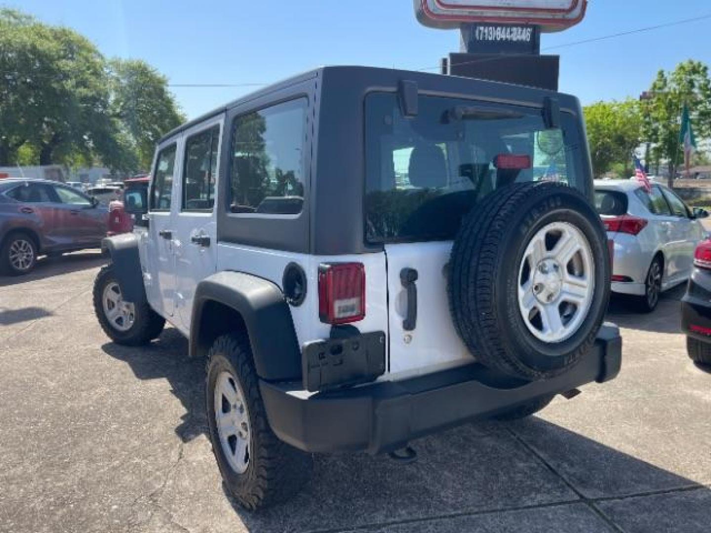 2016 Bright White Clearcoat Jeep Wrangler Unlimited Sport RHD (1C4BJWKG4GL) with an Pentastar 3.6L V-6 DOHC engine, located at 7935 Gulf Freeway, Houston, 77017, (832) 266-1645, 29.684393, -95.275665 - Photo#4