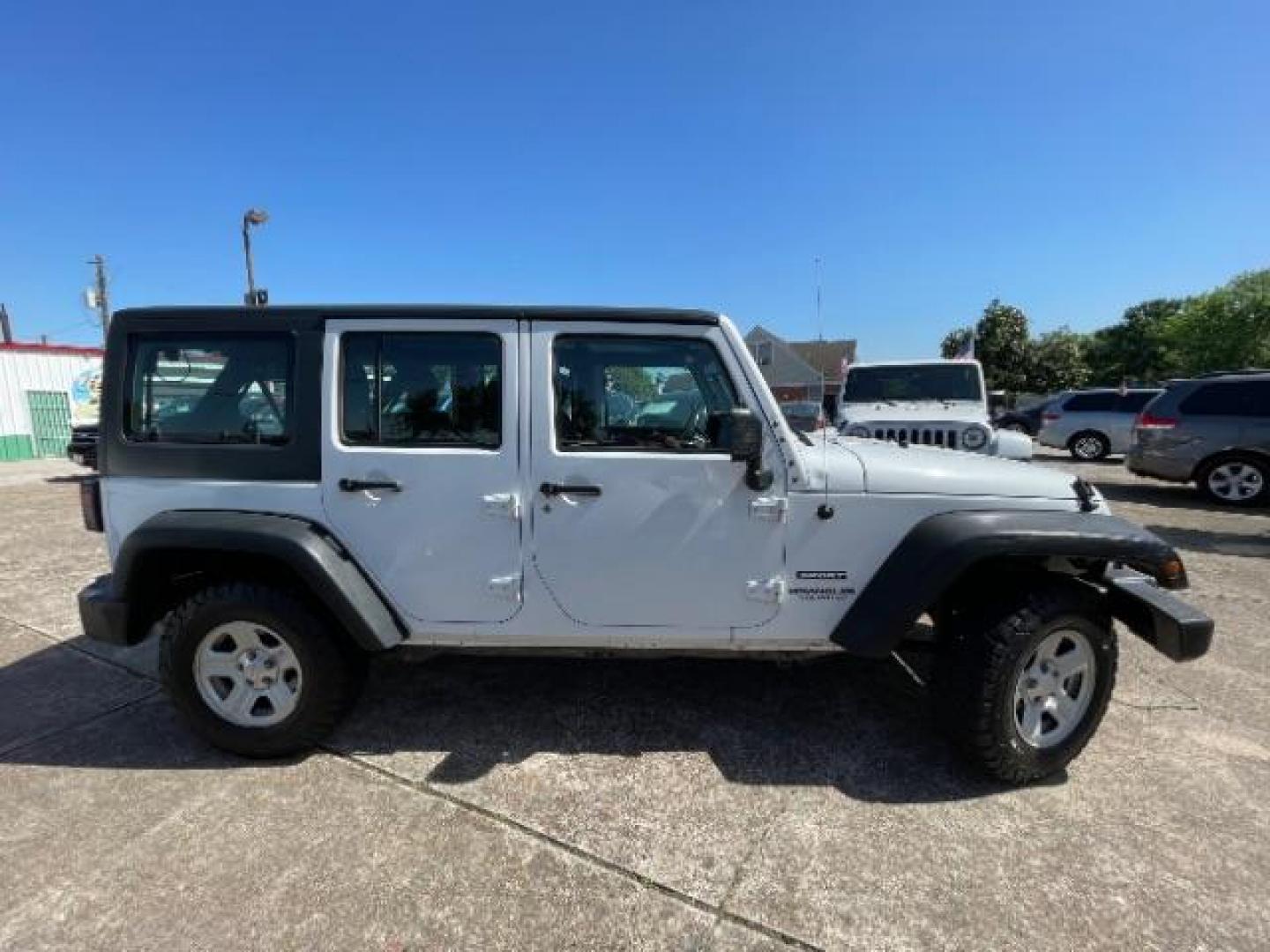 2016 Bright White Clearcoat Jeep Wrangler Unlimited Sport RHD (1C4BJWKG4GL) with an Pentastar 3.6L V-6 DOHC engine, located at 7935 Gulf Freeway, Houston, 77017, (832) 266-1645, 29.684393, -95.275665 - Photo#7