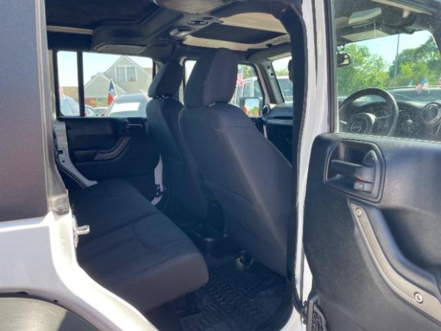 2016 Bright White Clearcoat Jeep Wrangler Unlimited Sport RHD (1C4BJWKG4GL) with an Pentastar 3.6L V-6 DOHC engine, located at 7935 Gulf Freeway, Houston, 77017, (832) 266-1645, 29.684393, -95.275665 - Photo#9
