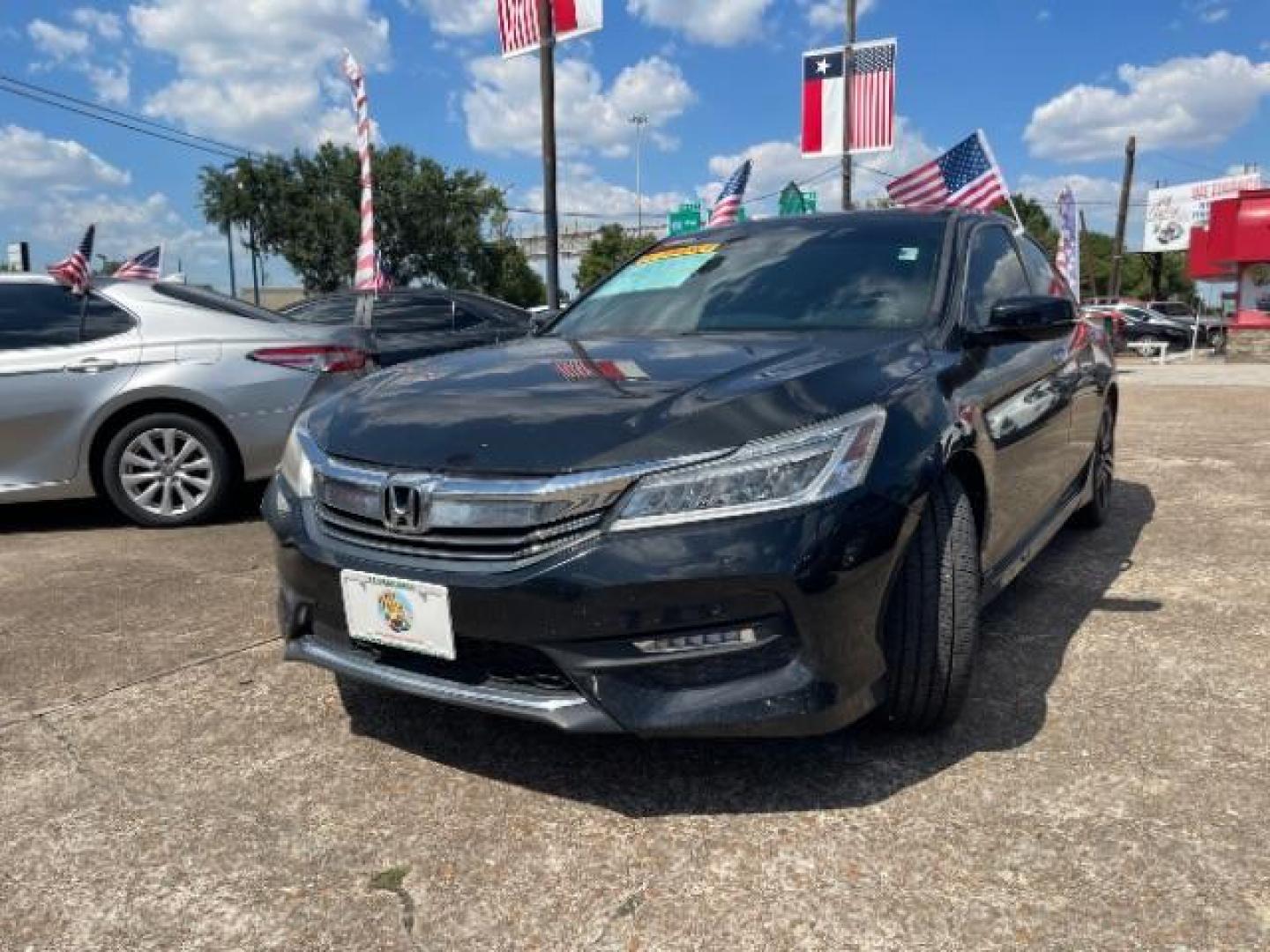 2016 Crystal Black Pearl /Black Honda Accord Touring (1HGCR3F97GA) with an 3.5L V-6 i-VTEC variable valve control engine, located at 7935 Gulf Freeway, Houston, 77017, (832) 266-1645, 29.684393, -95.275665 - Photo#0