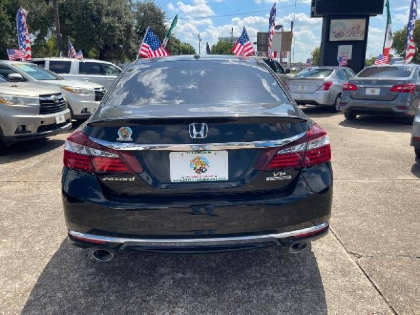 2016 Crystal Black Pearl /Black Honda Accord Touring (1HGCR3F97GA) with an 3.5L V-6 i-VTEC variable valve control engine, located at 7935 Gulf Freeway, Houston, 77017, (832) 266-1645, 29.684393, -95.275665 - Photo#2